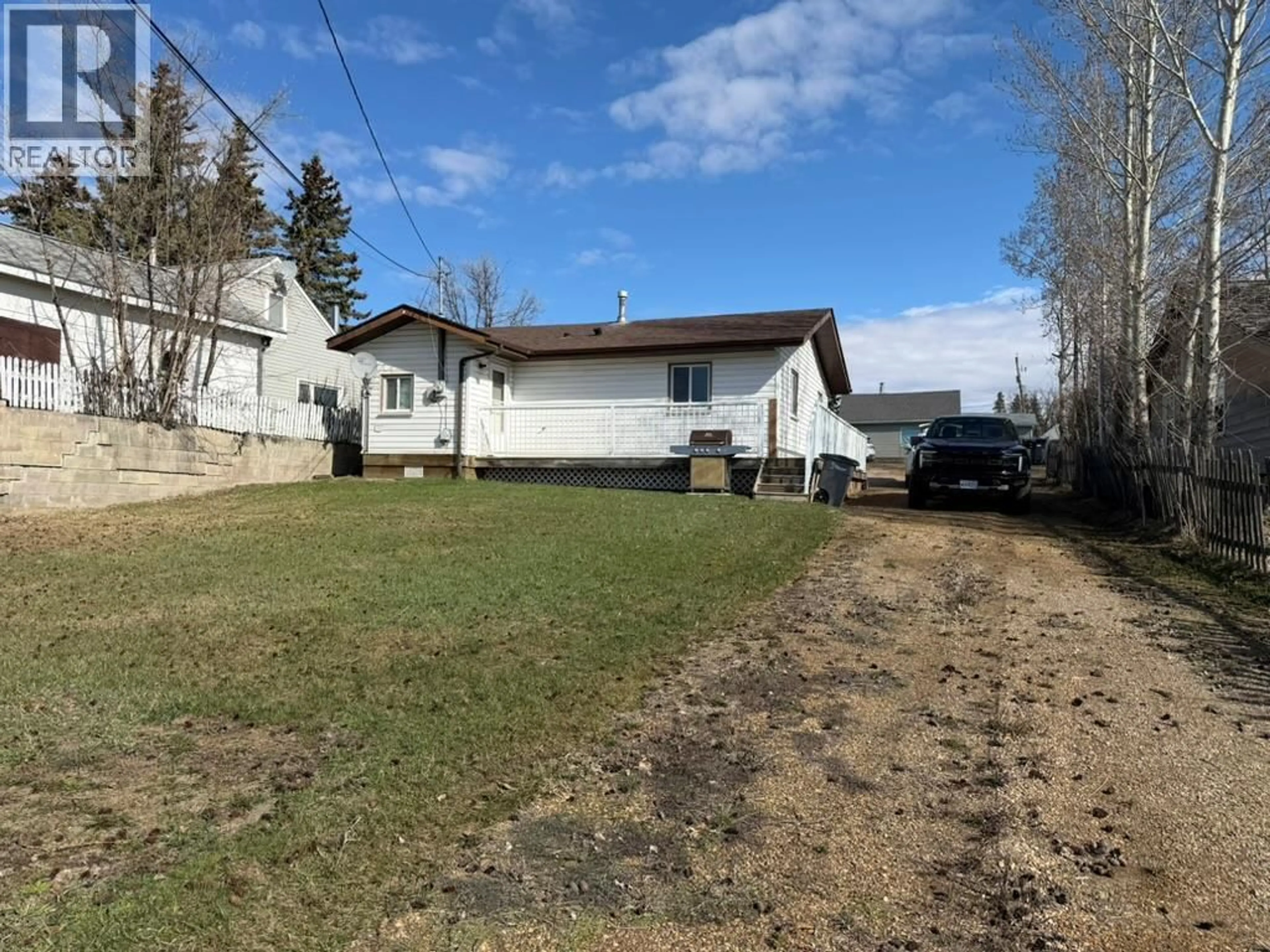 A pic from outside/outdoor area/front of a property/back of a property/a pic from drone, street for 309 100A AVENUE, Dawson Creek British Columbia V1G1X5