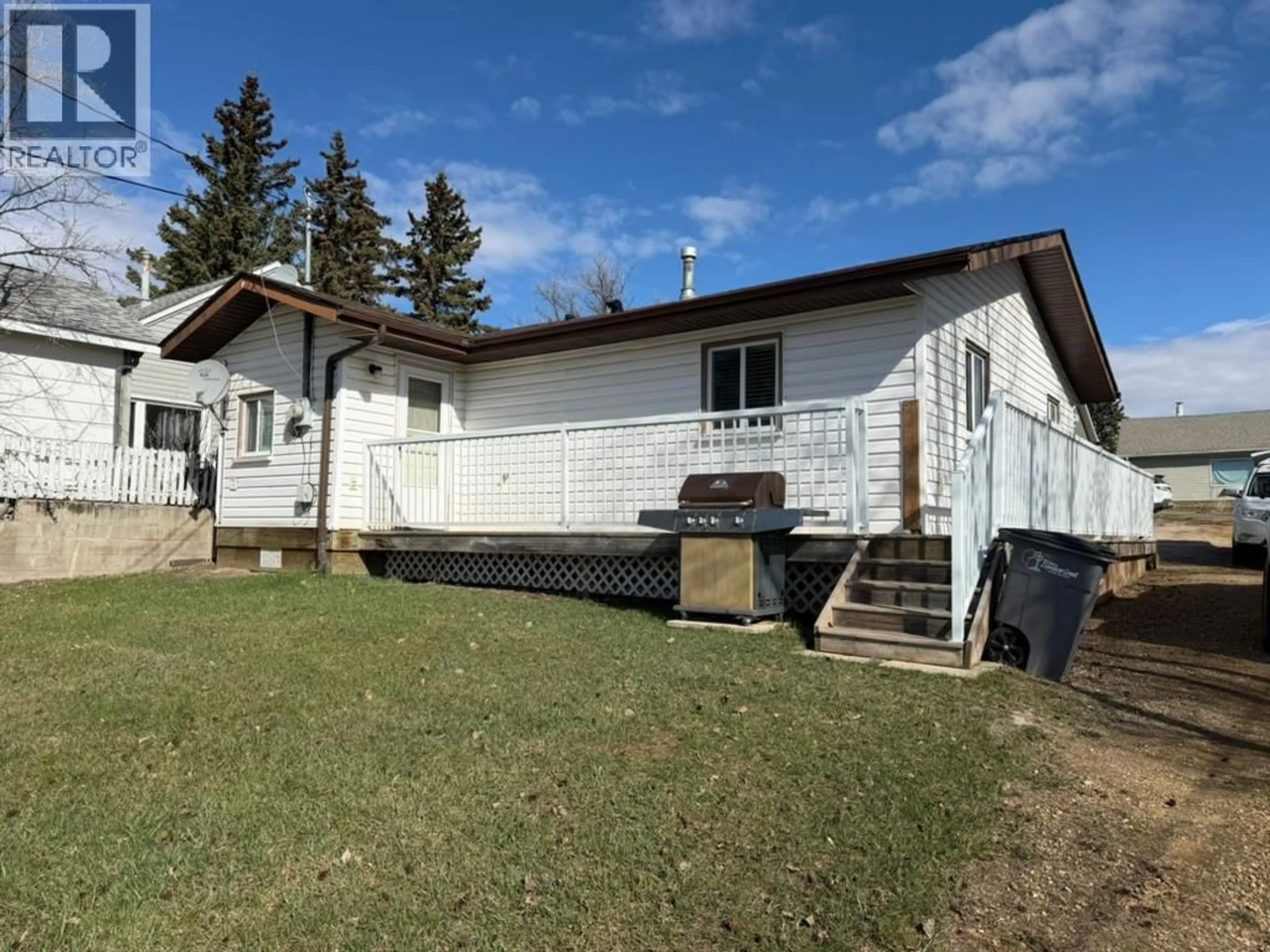 A pic from outside/outdoor area/front of a property/back of a property/a pic from drone, building for 309 100A AVENUE, Dawson Creek British Columbia V1G1X5