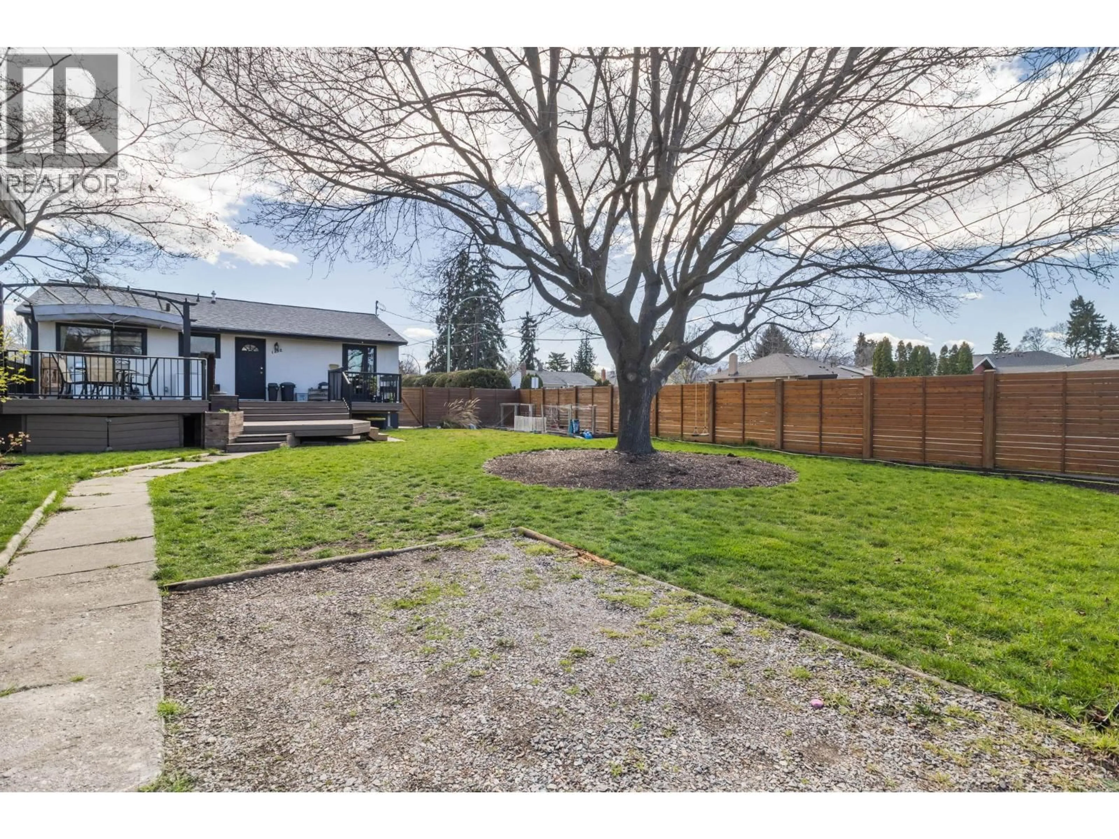 A pic from outside/outdoor area/front of a property/back of a property/a pic from drone, street for 1892 CARRUTHERS STREET, Kelowna British Columbia V1Y3B6