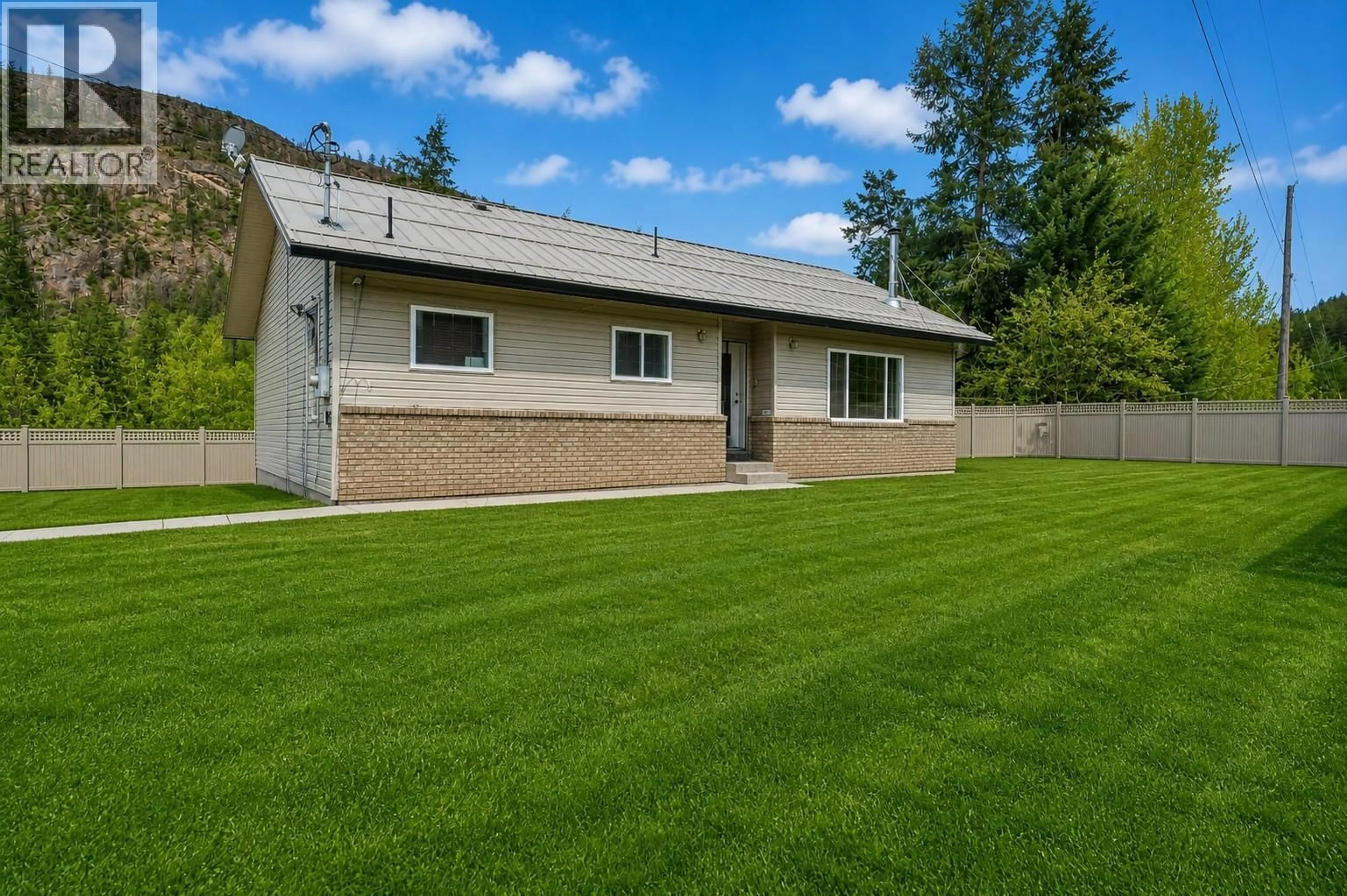 Home with vinyl exterior material, street for 523 GRAND ORO ROAD, Kaleden British Columbia V0H1K0