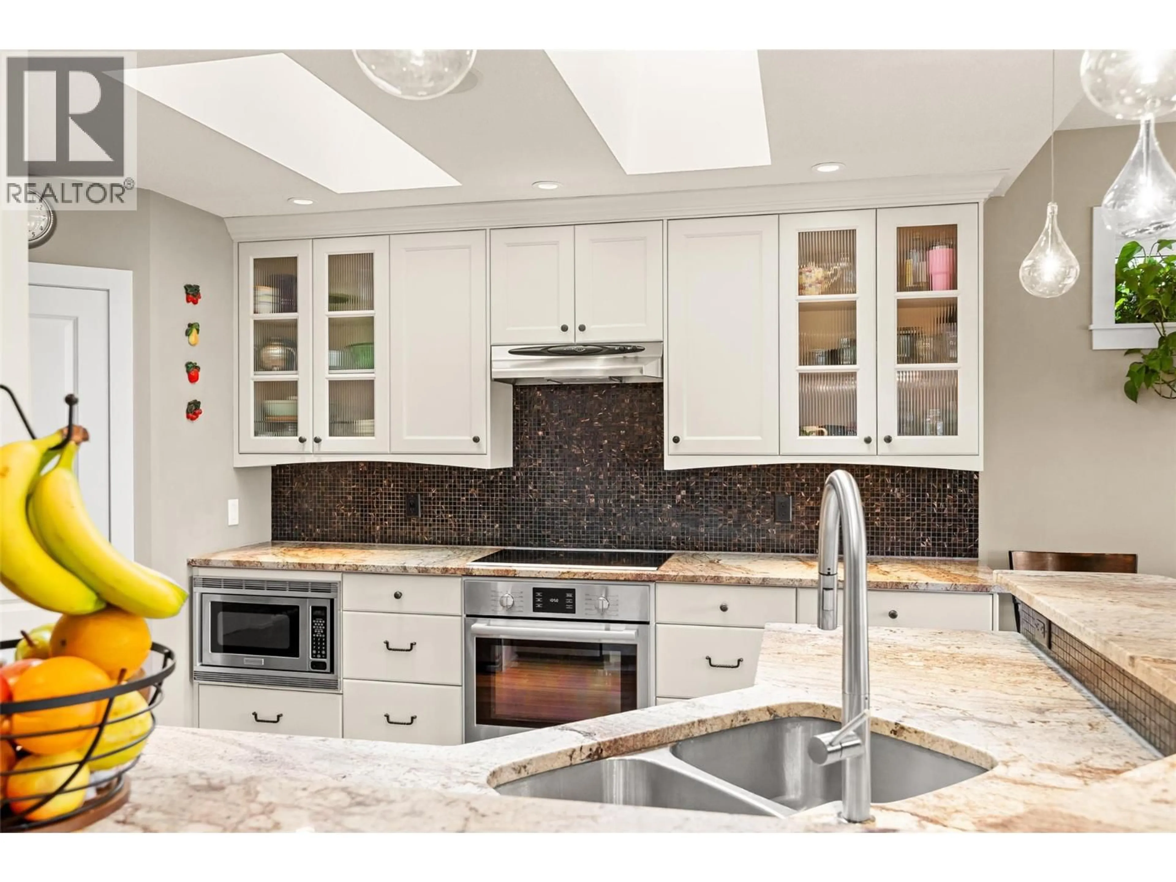 Contemporary kitchen, ceramic/tile floor for 5234 BENMORE COURT, Kelowna British Columbia V1W4Z3
