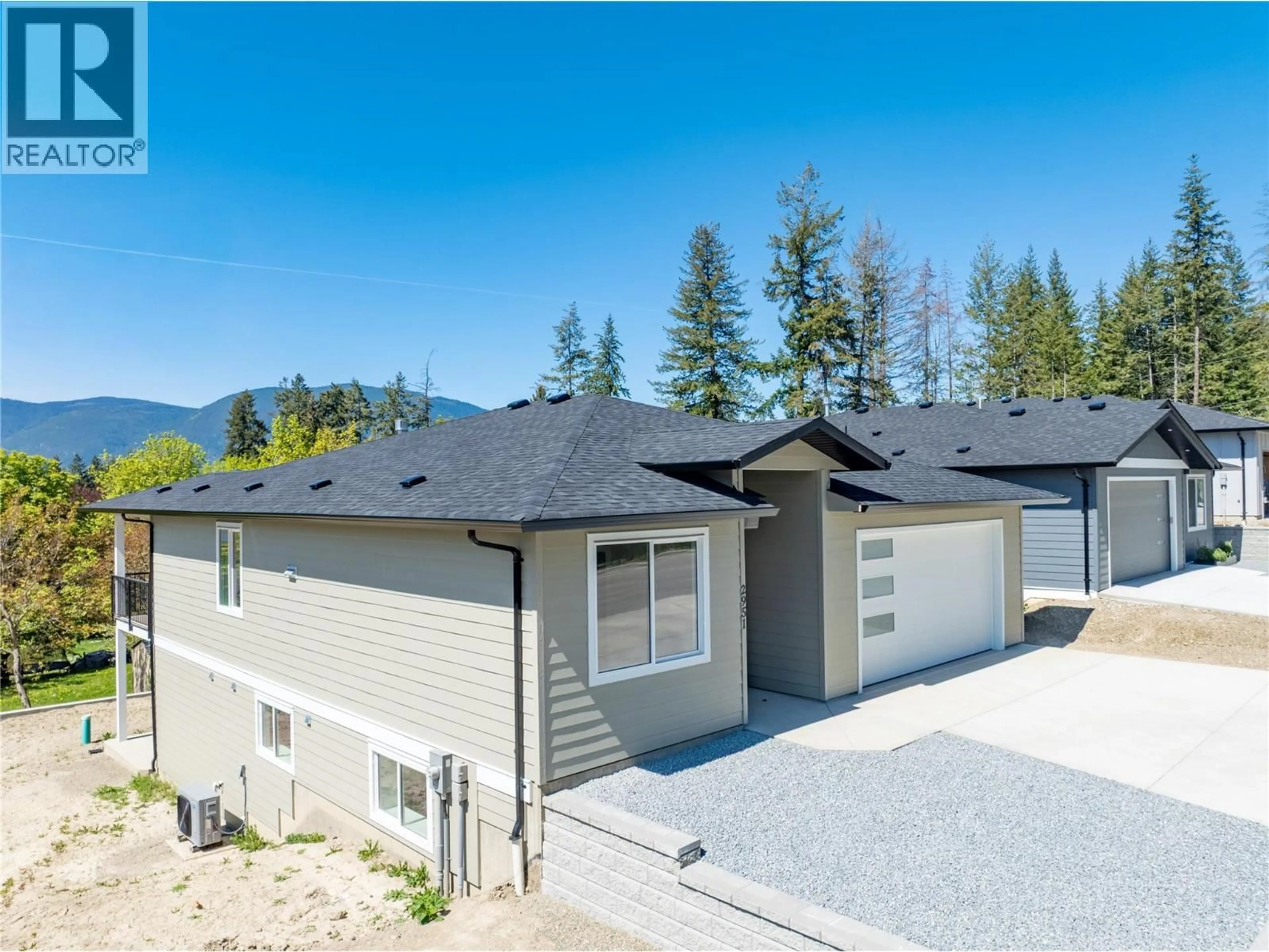 A pic from outside/outdoor area/front of a property/back of a property/a pic from drone, mountain view for 2951 27 STREET NORTHEAST, Salmon Arm British Columbia V1E2Z7