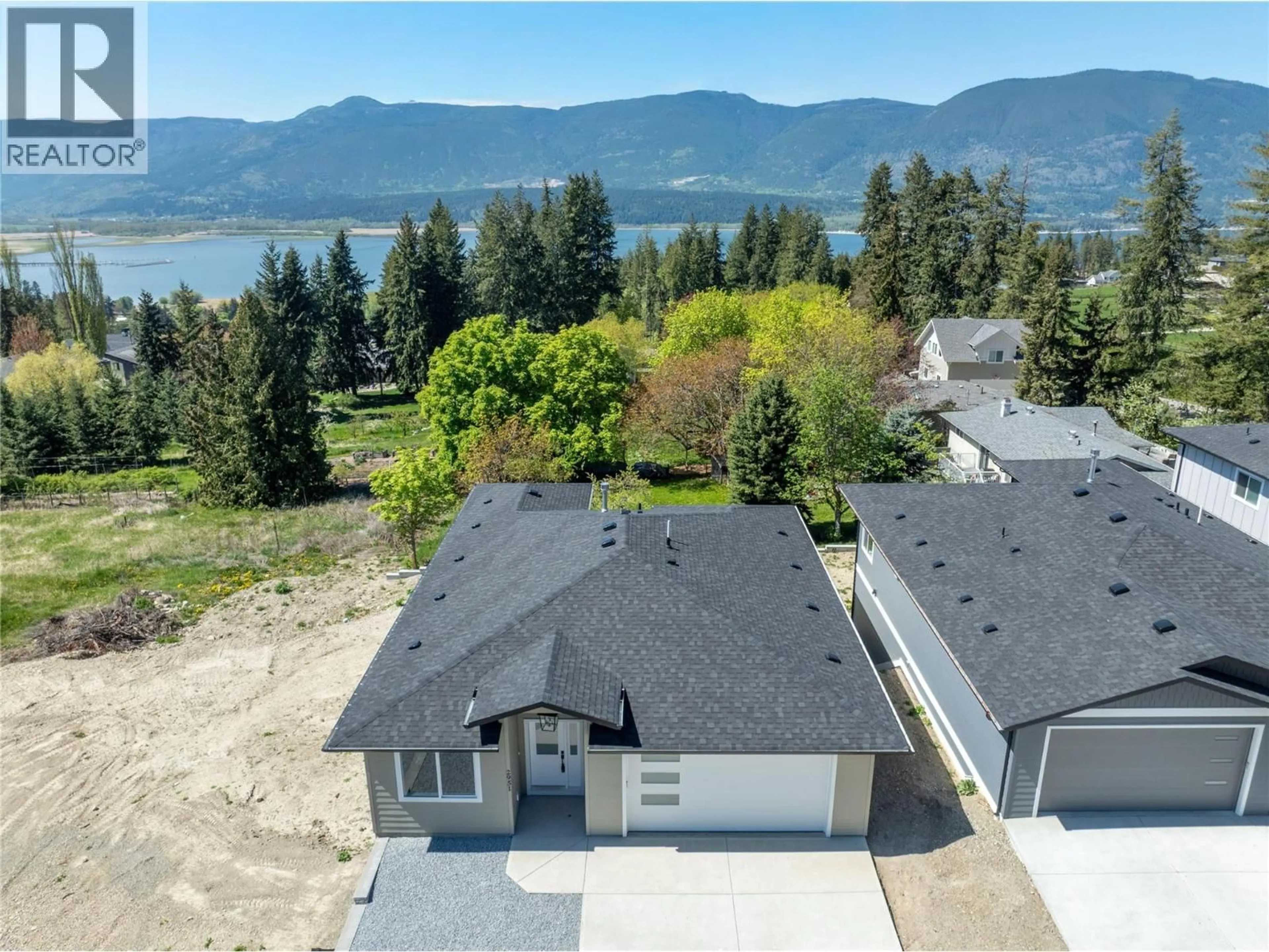 A pic from outside/outdoor area/front of a property/back of a property/a pic from drone, water/lake/river/ocean view for 2951 27 STREET NORTHEAST, Salmon Arm British Columbia V1E2Z7