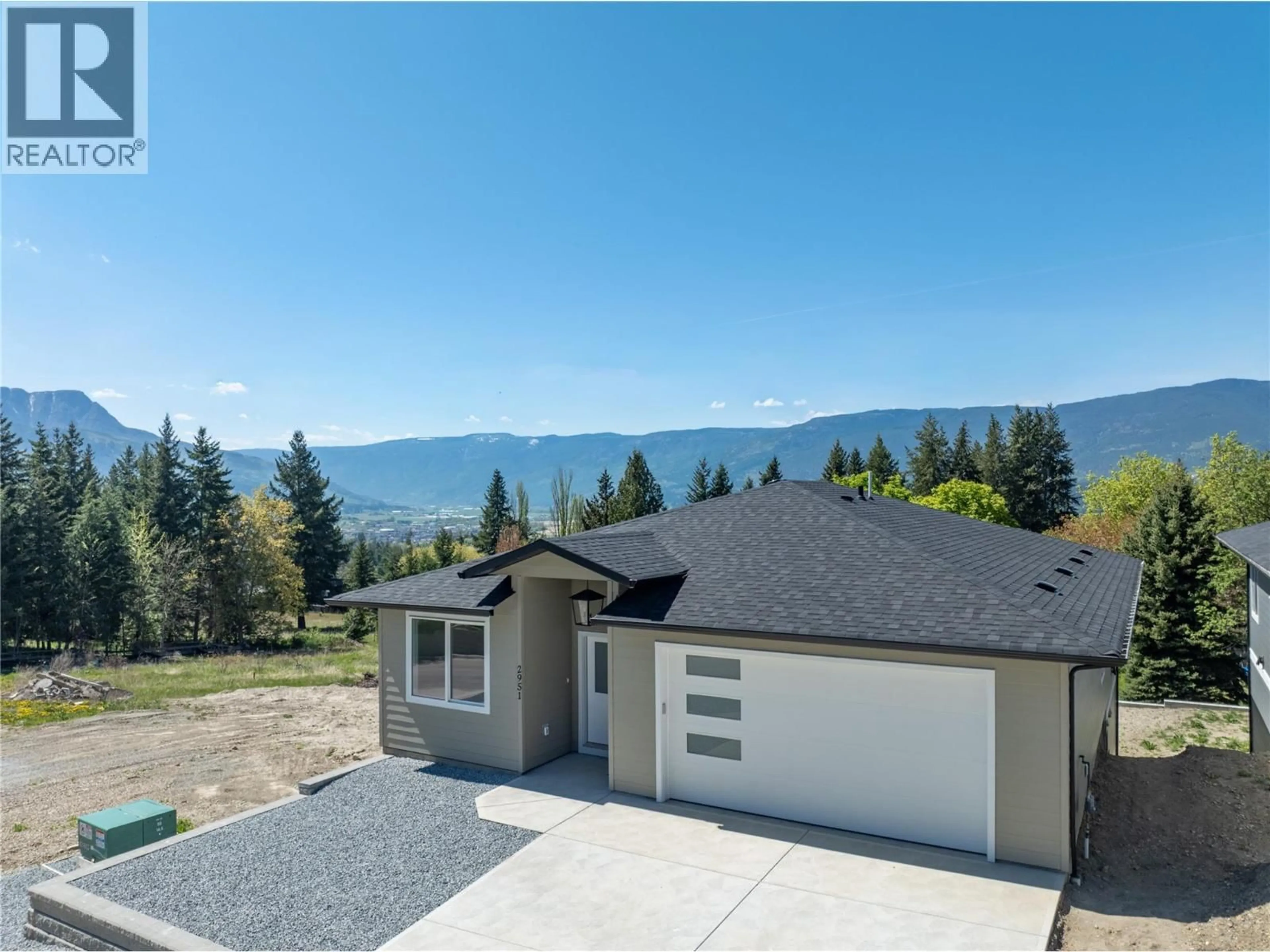 A pic from outside/outdoor area/front of a property/back of a property/a pic from drone, water/lake/river/ocean view for 2951 27 STREET NORTHEAST, Salmon Arm British Columbia V1E2Z7