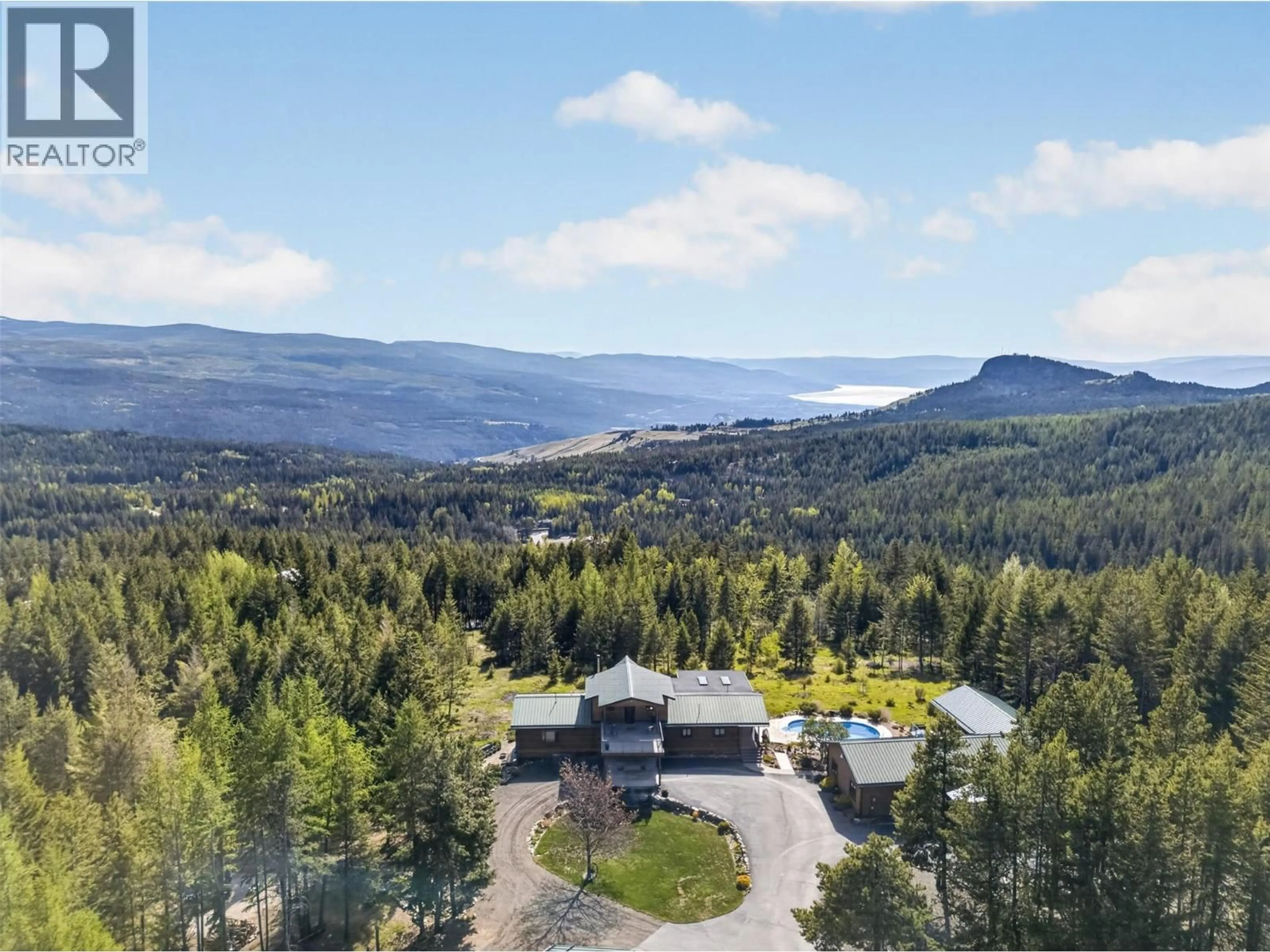A pic from outside/outdoor area/front of a property/back of a property/a pic from drone, mountain view for 7319 TRAPPER COURT, Kelowna British Columbia V1P1H7