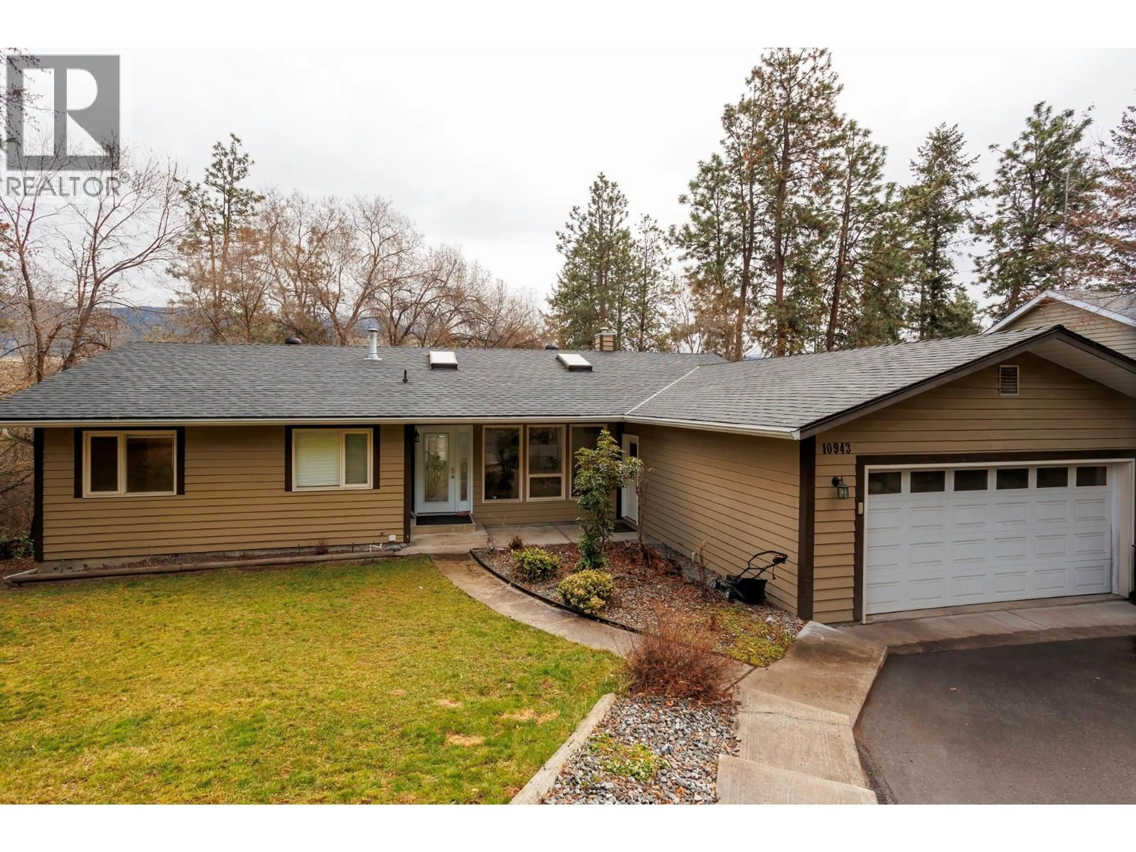 Home with vinyl exterior material, street for 10943 EVA ROAD, Lake Country British Columbia V4V1H4