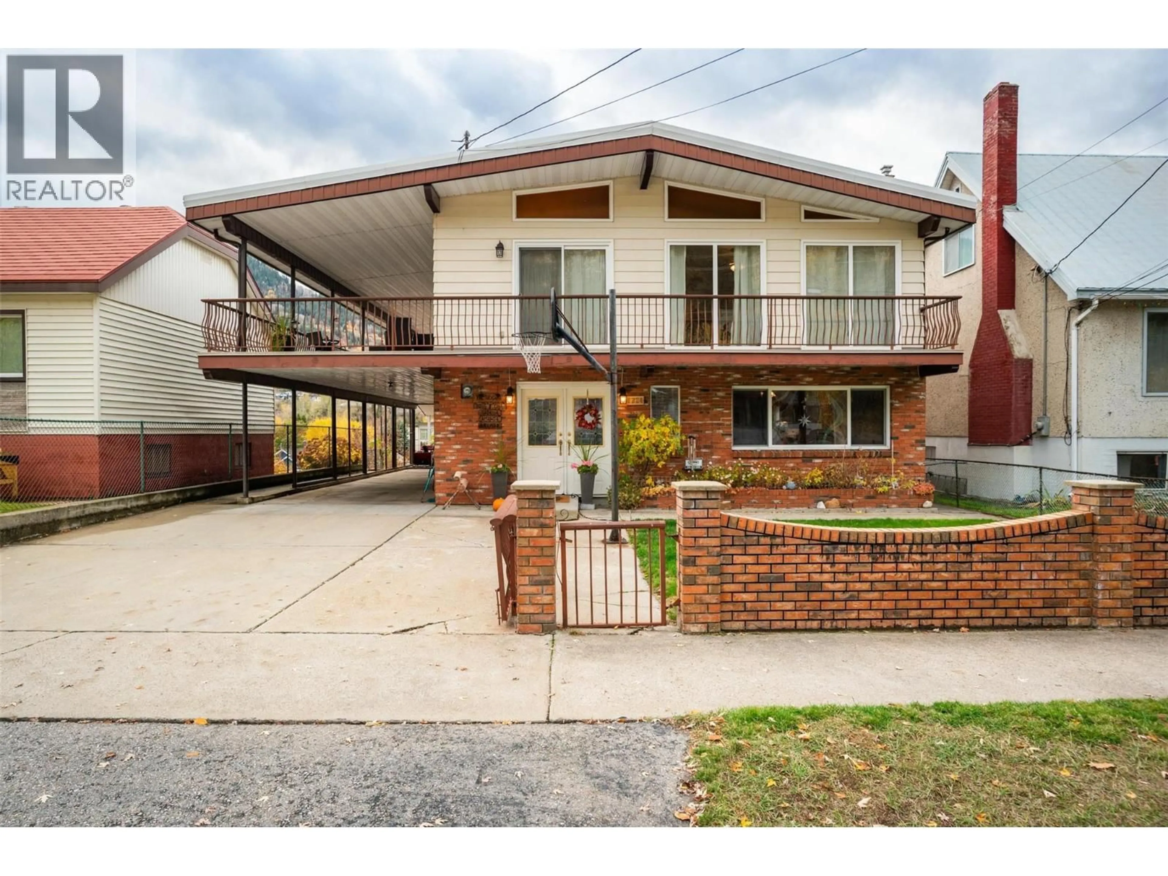 Home with brick exterior material, street for 1224 THIRD AVENUE, Trail British Columbia V1R1P2