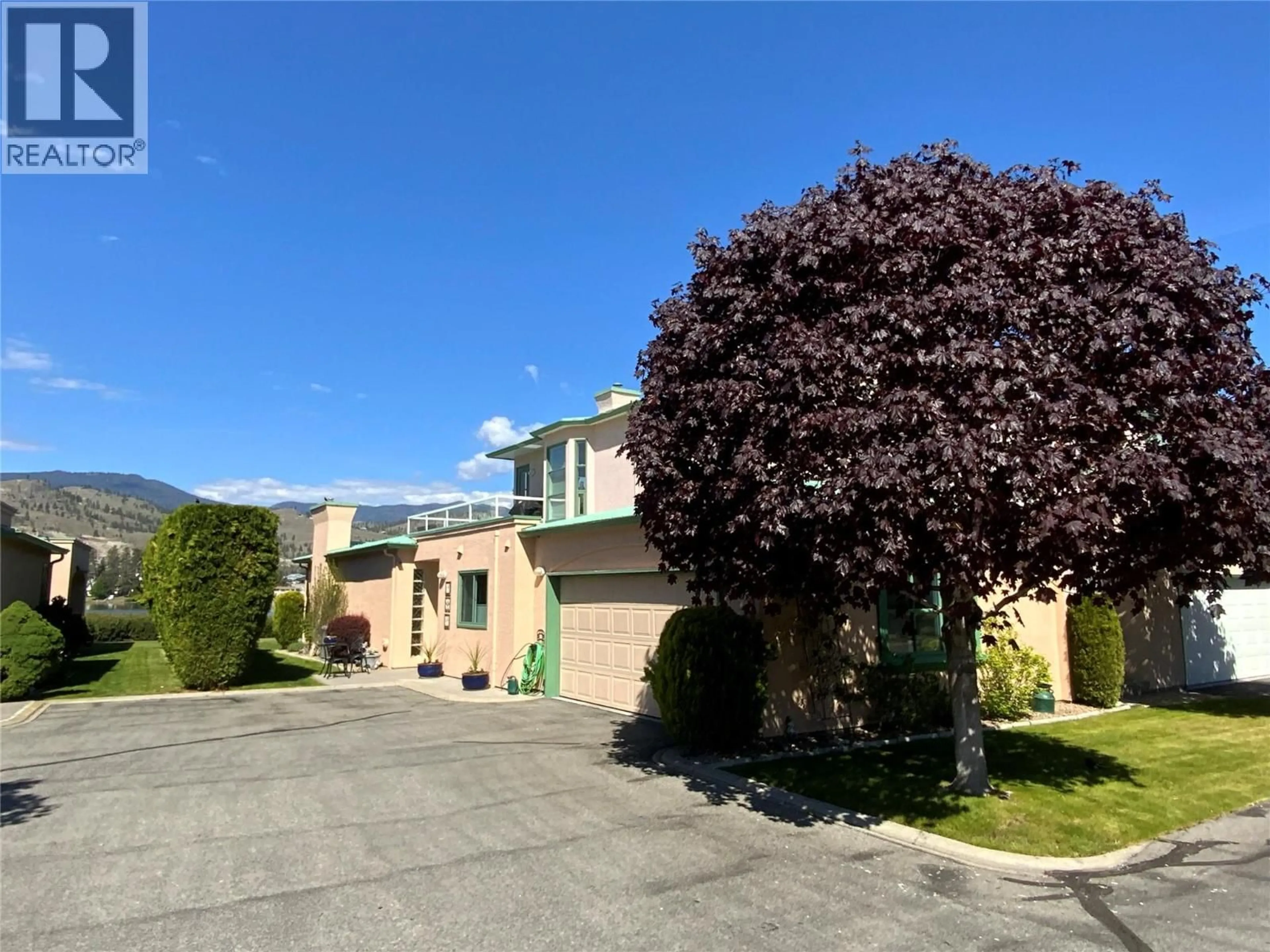 A pic from outside/outdoor area/front of a property/back of a property/a pic from drone, street for 30 - 6916 TUCELNUIT DRIVE, Oliver British Columbia V0H1T0