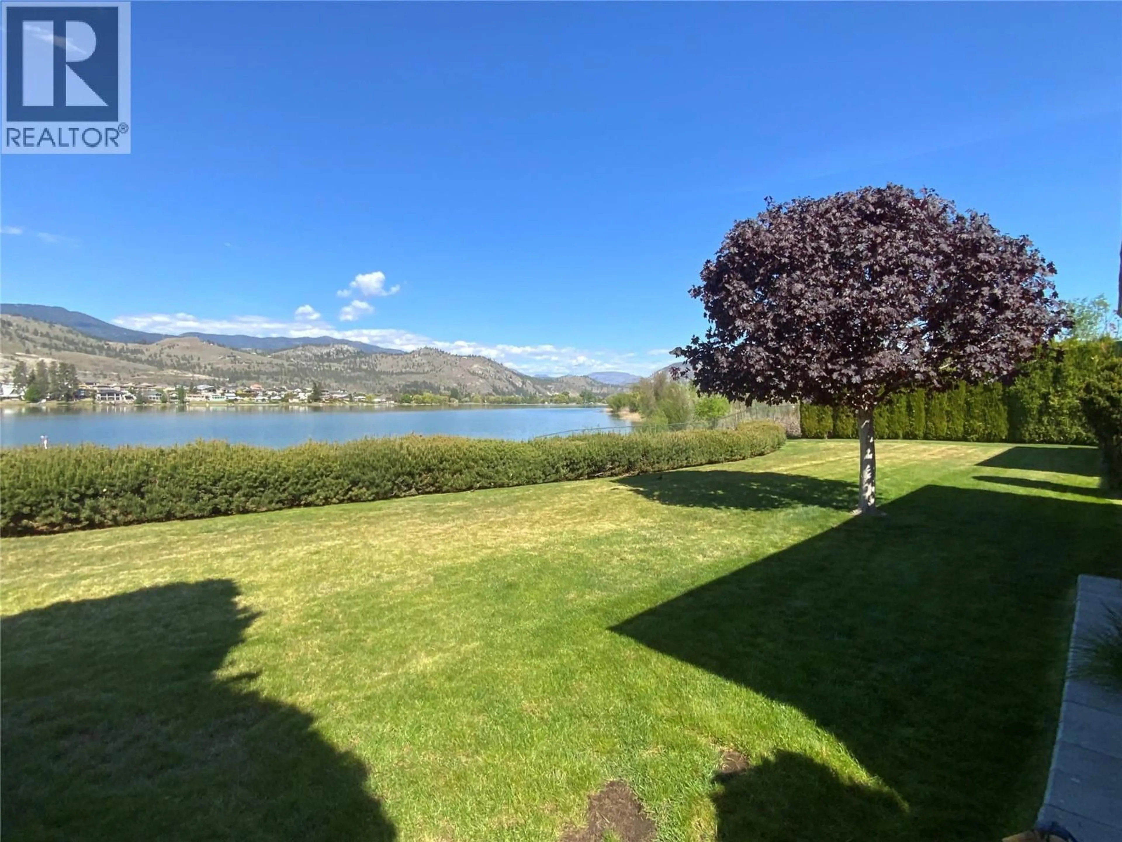A pic from outside/outdoor area/front of a property/back of a property/a pic from drone, water/lake/river/ocean view for 30 - 6916 TUCELNUIT DRIVE, Oliver British Columbia V0H1T0