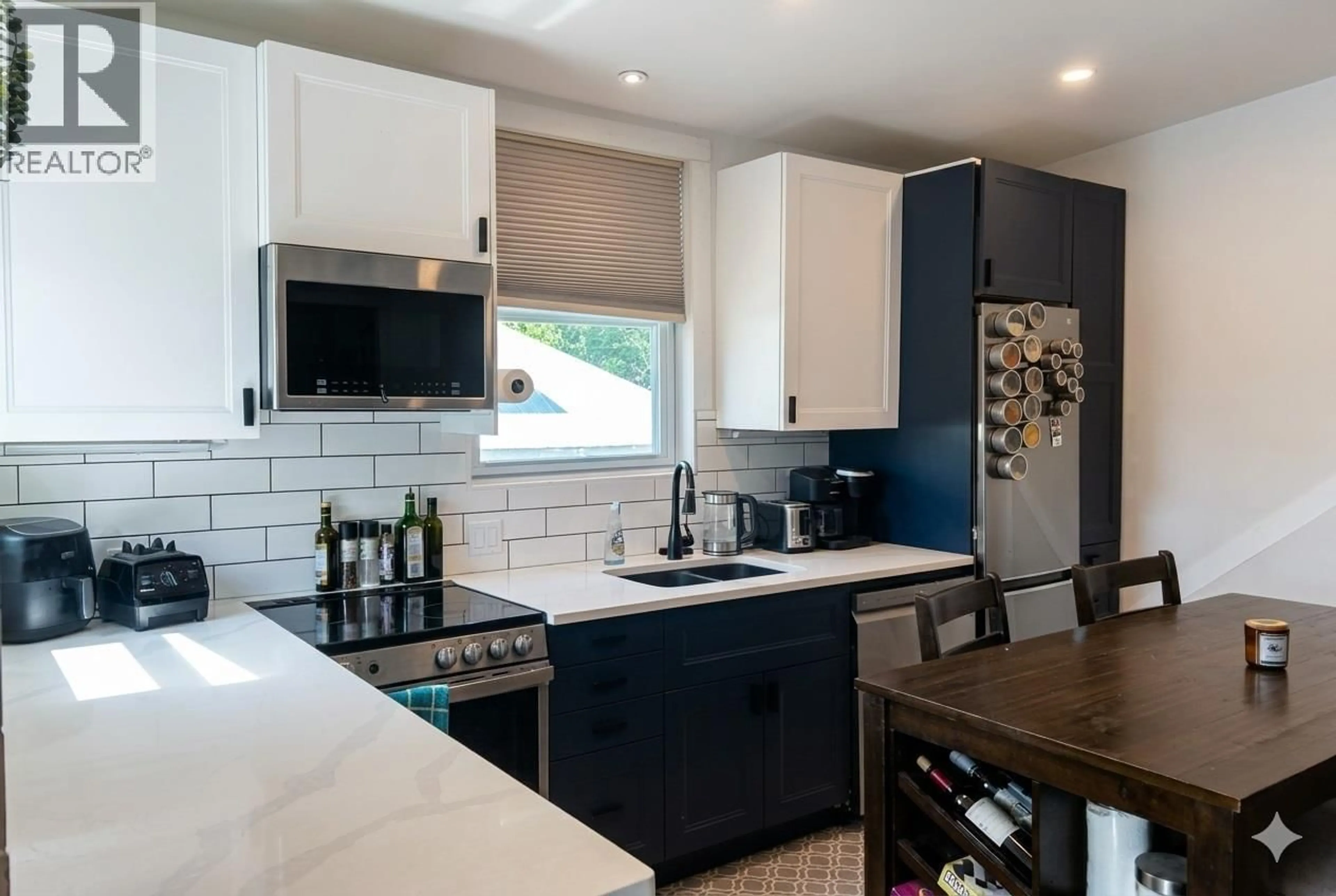 Open concept kitchen, ceramic/tile floor for 3403 33 AVENUE, Vernon British Columbia V1T2P2