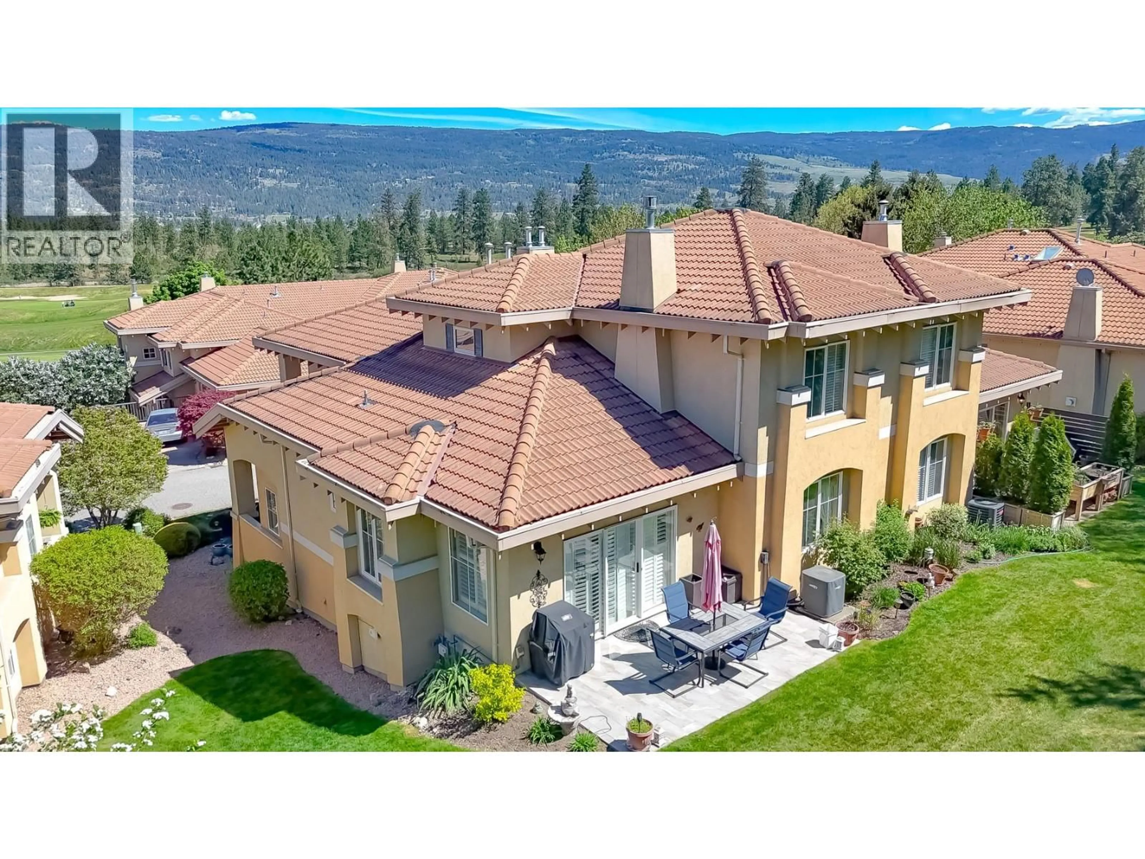 A pic from outside/outdoor area/front of a property/back of a property/a pic from drone, mountain view for 2310 COUNTRY CLUB DRIVE, Kelowna British Columbia V1V2A6