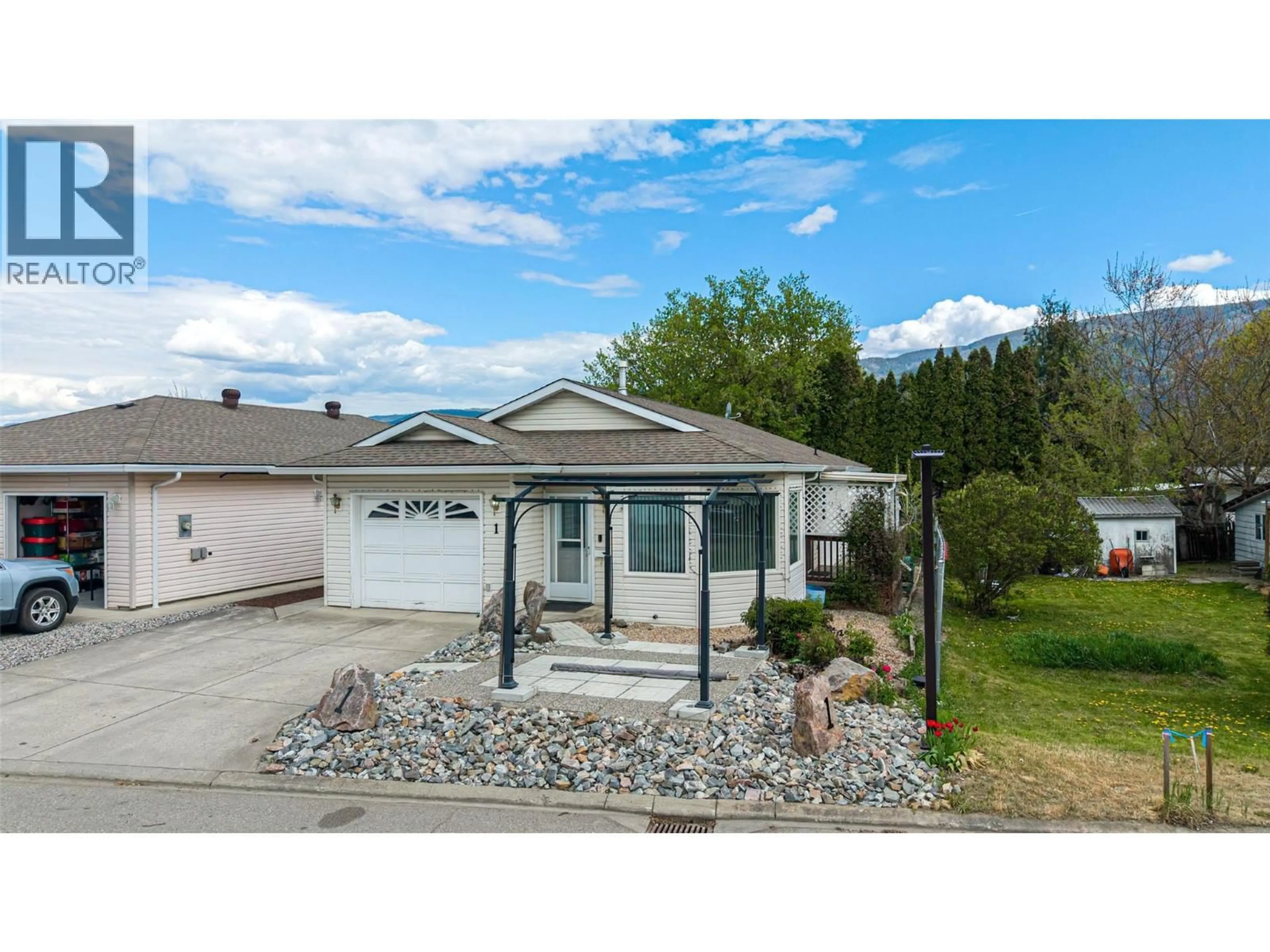 Home with vinyl exterior material, street for 1 - 2716 WOLFENDEN TERRACE, Armstrong British Columbia V4Y2A6