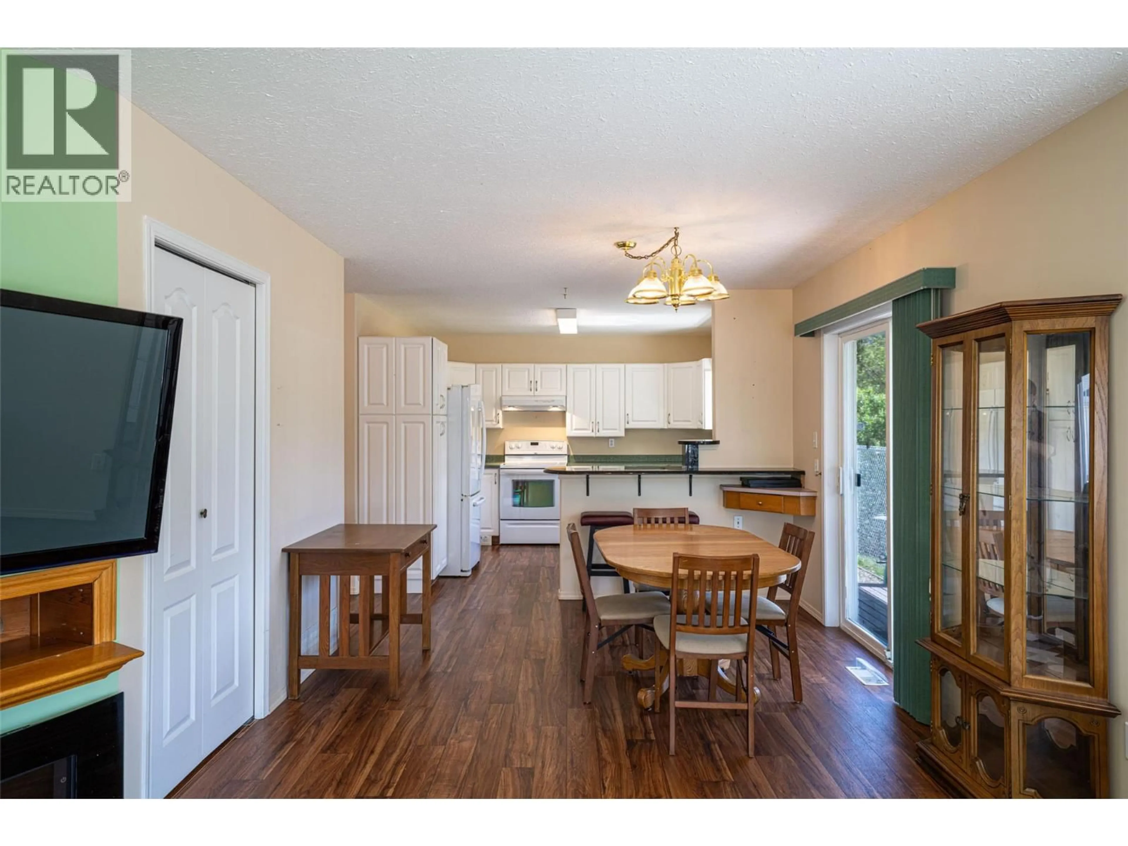 Open concept kitchen, wood/laminate floor for 1 - 2716 WOLFENDEN TERRACE, Armstrong British Columbia V4Y2A6