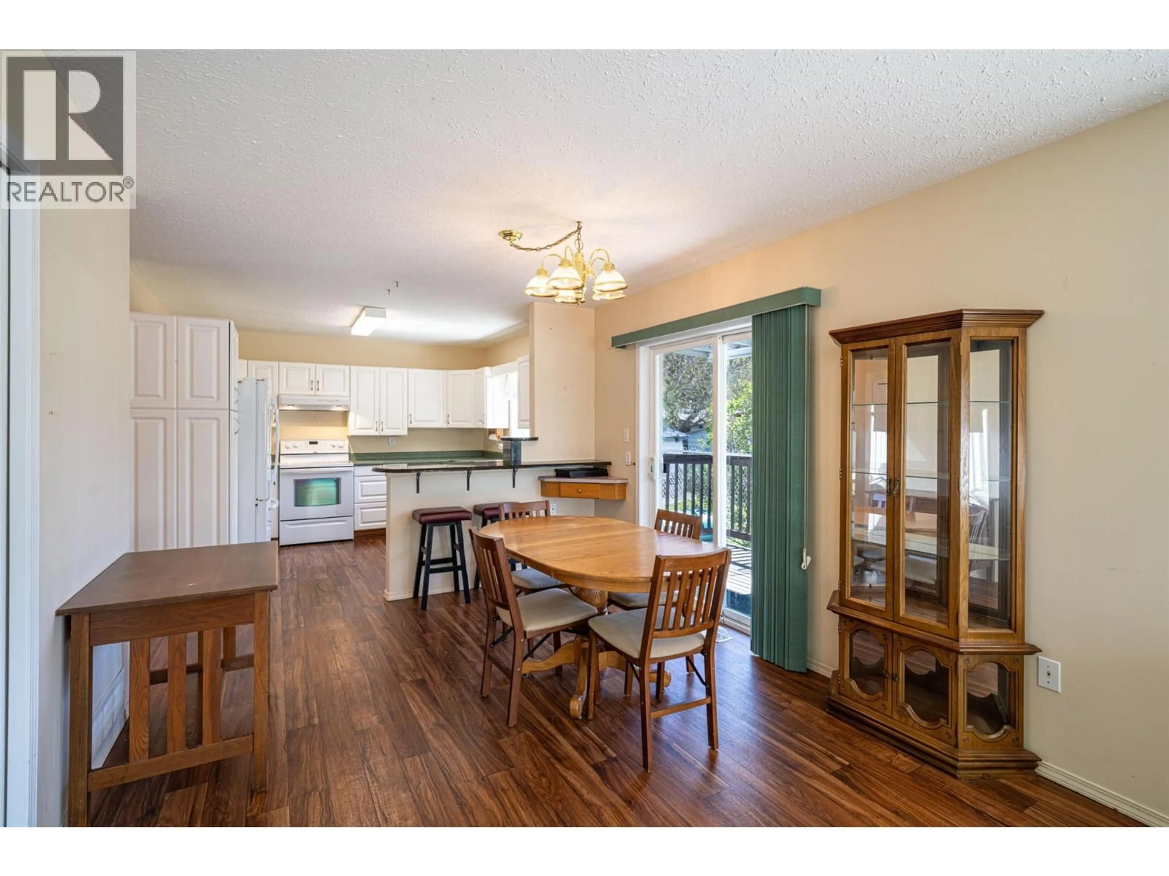 Open concept kitchen, wood/laminate floor for 1 - 2716 WOLFENDEN TERRACE, Armstrong British Columbia V4Y2A6