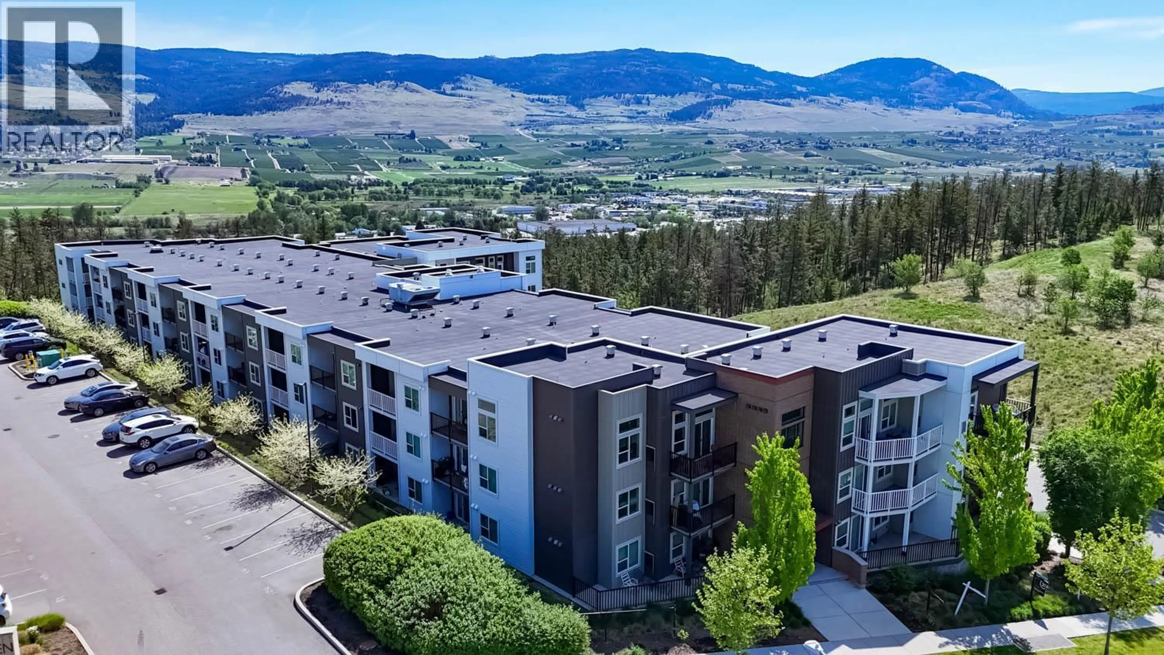 A pic from outside/outdoor area/front of a property/back of a property/a pic from drone, mountain view for 223 - 625 ACADEMY WAY, Kelowna British Columbia V1V0E3
