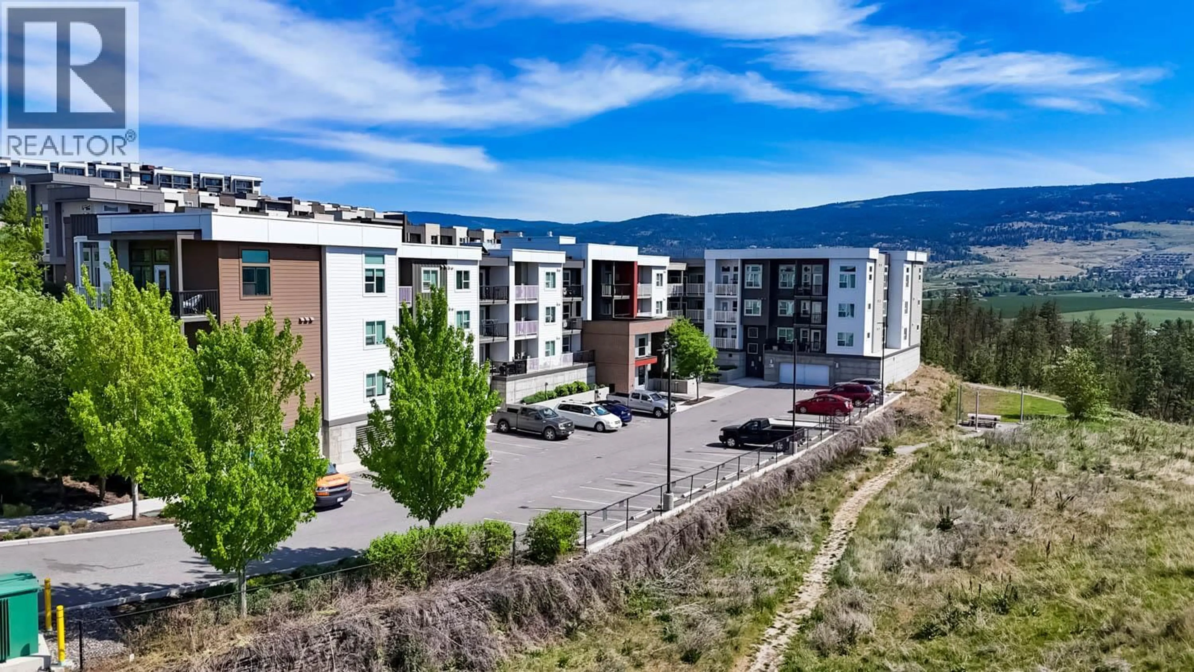 A pic from outside/outdoor area/front of a property/back of a property/a pic from drone, mountain view for 223 - 625 ACADEMY WAY, Kelowna British Columbia V1V0E3