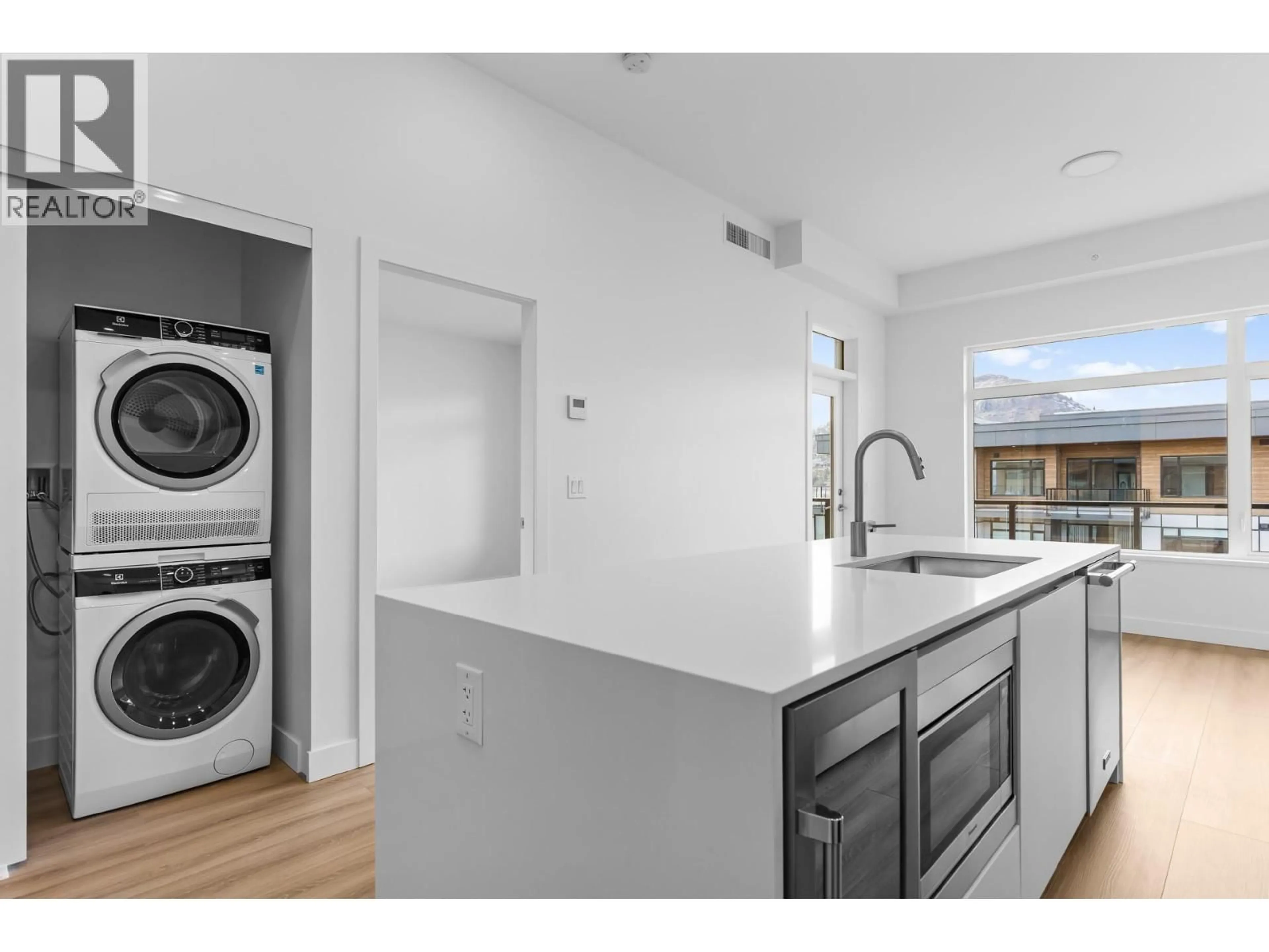 Kitchen with laundary machines, unknown for 603 - 2780 OLALLA ROAD, West Kelowna British Columbia V1Z2A9