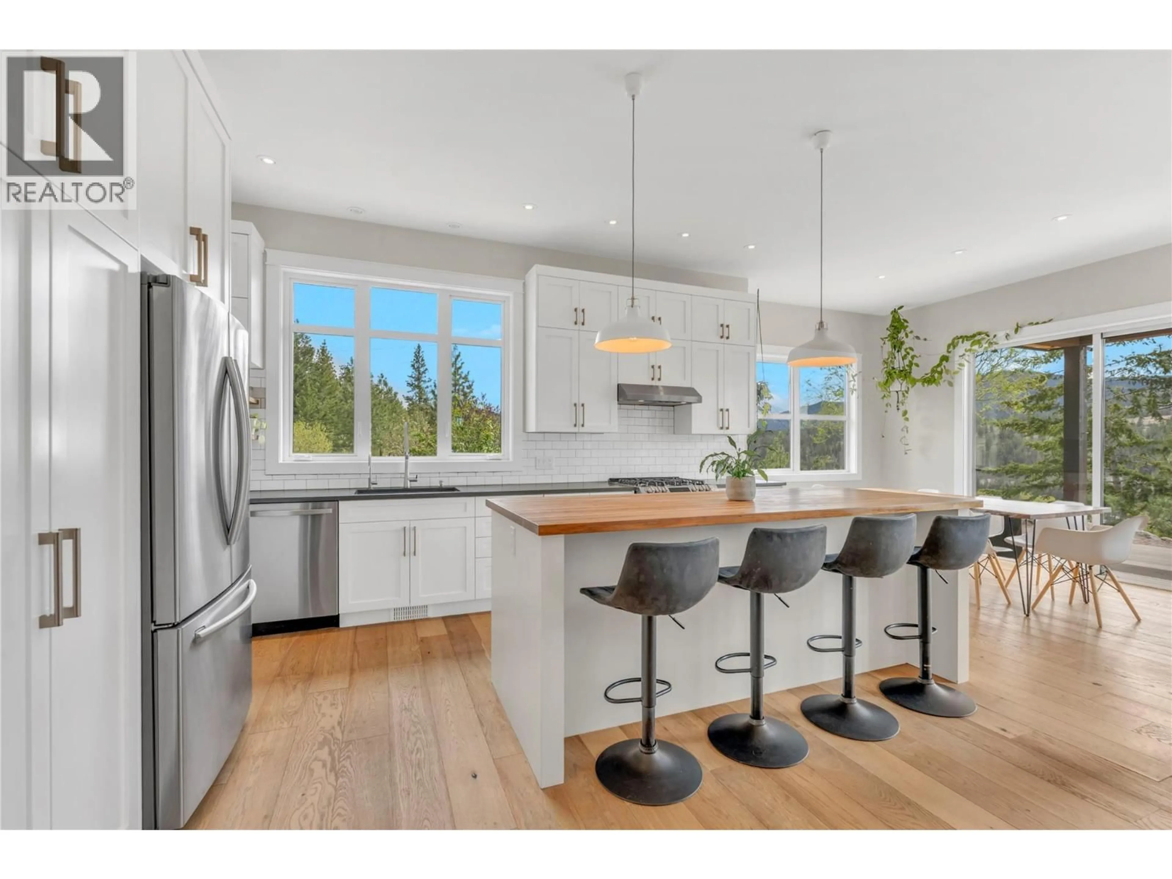 Open concept kitchen, wood/laminate floor for 8388 PRINCETON SUMMERLAND ROAD, Summerland British Columbia V0H1Z8