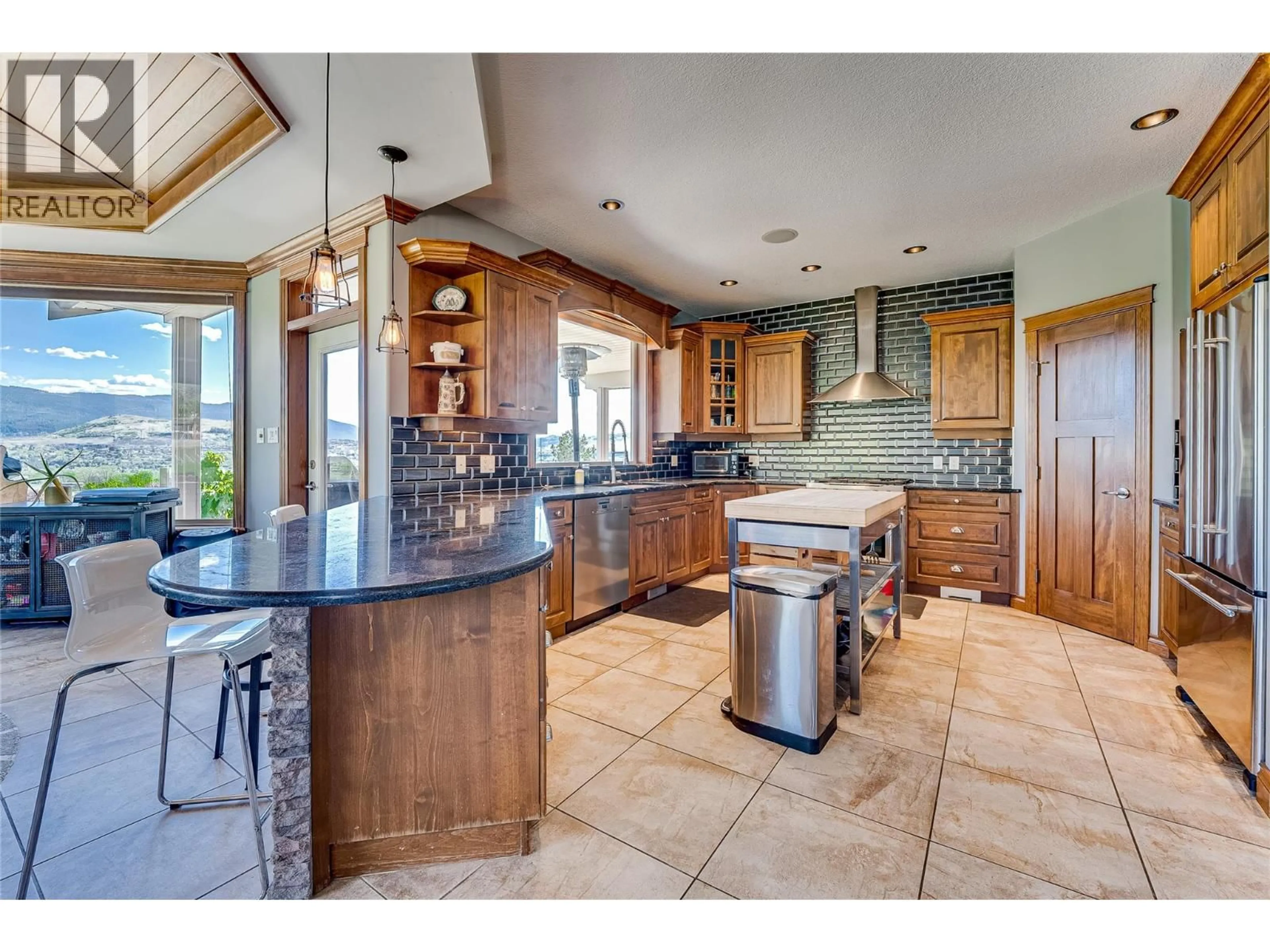 Open concept kitchen, ceramic/tile floor for 900 33 AVENUE, Vernon British Columbia V1T9V7