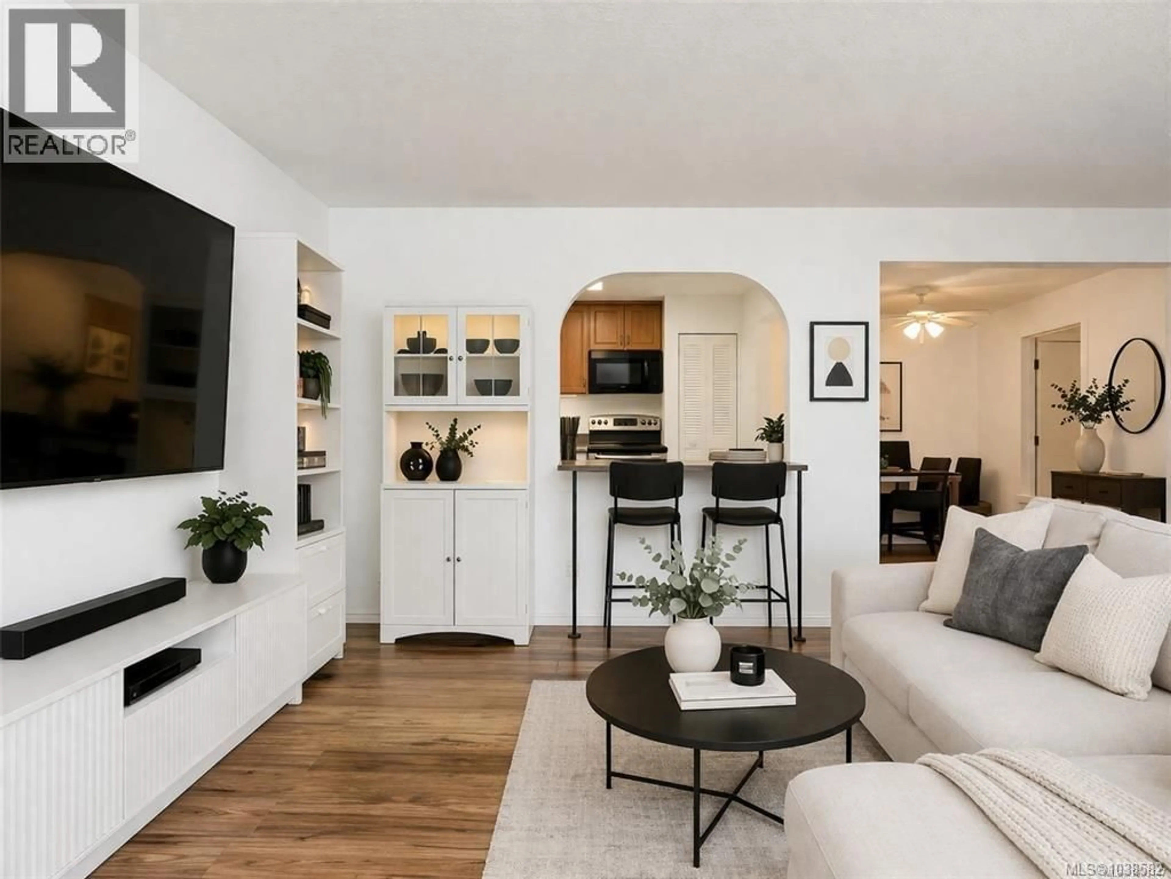 Living room with furniture, wood/laminate floor for 302 - 1005 MCKENZIE AVENUE, Saanich British Columbia V8X4A9