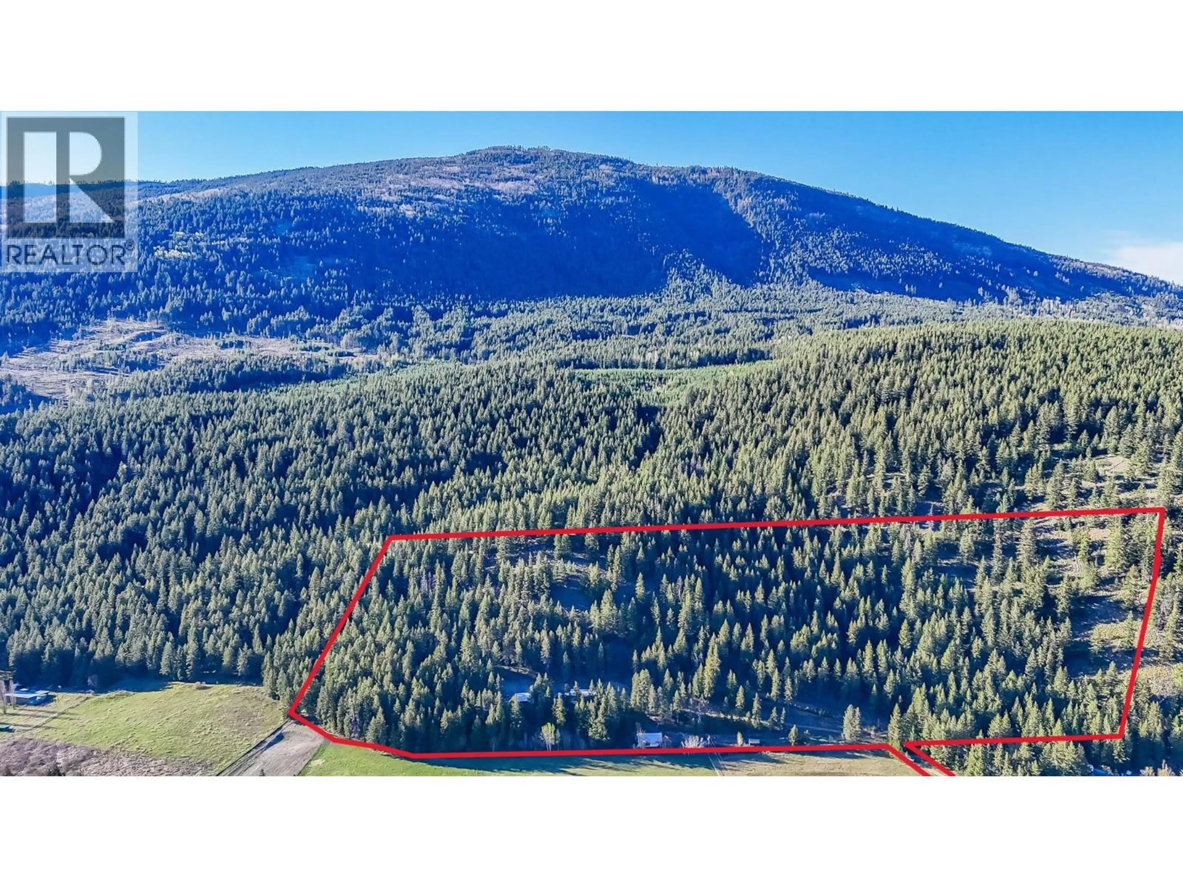 A pic from outside/outdoor area/front of a property/back of a property/a pic from drone, forest/trees view for 1771 SKIMIKIN ROAD, Tappen British Columbia V0E2X0