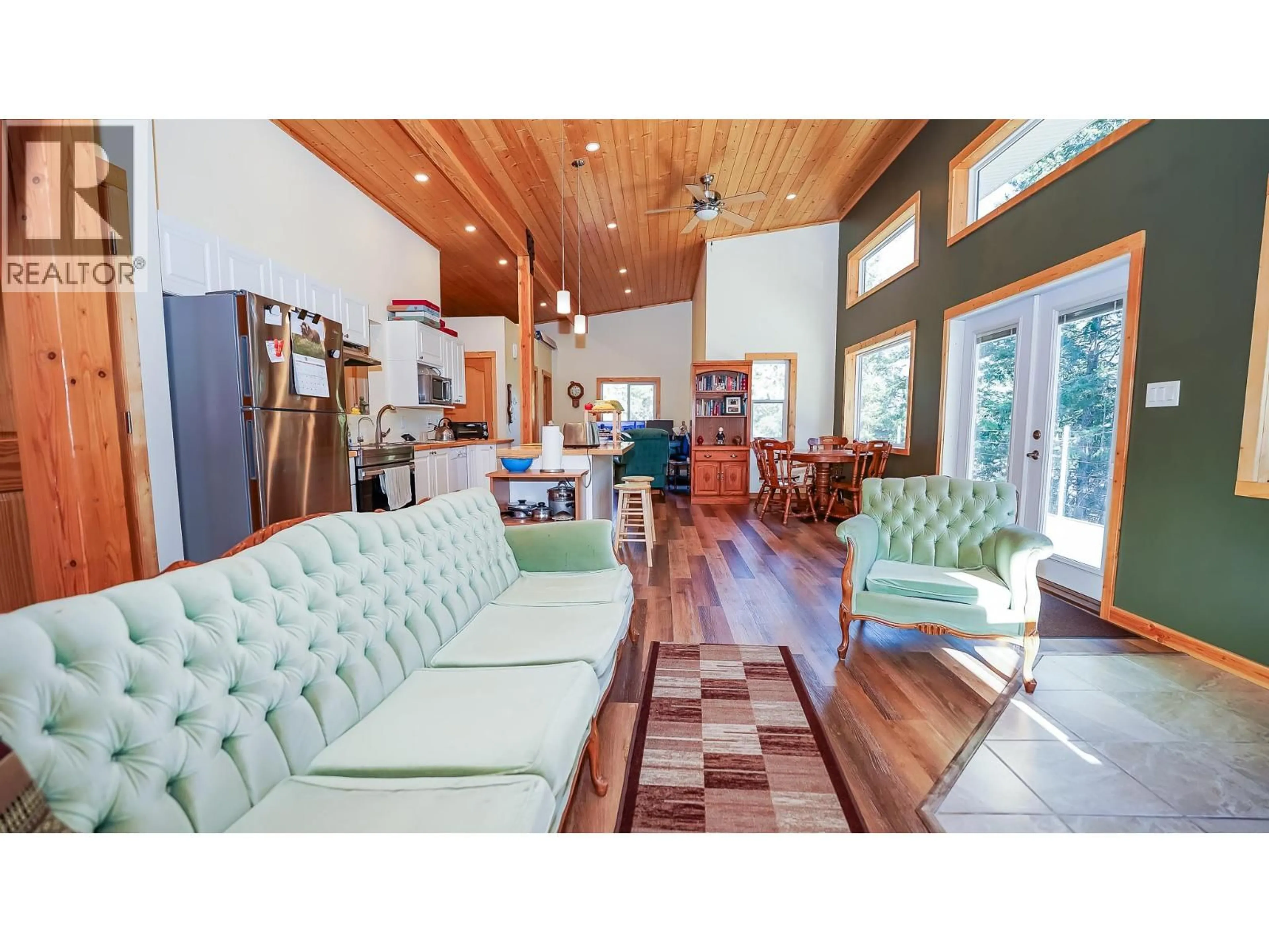 Living room with furniture, wood/laminate floor for 1771 SKIMIKIN ROAD, Tappen British Columbia V0E2X0