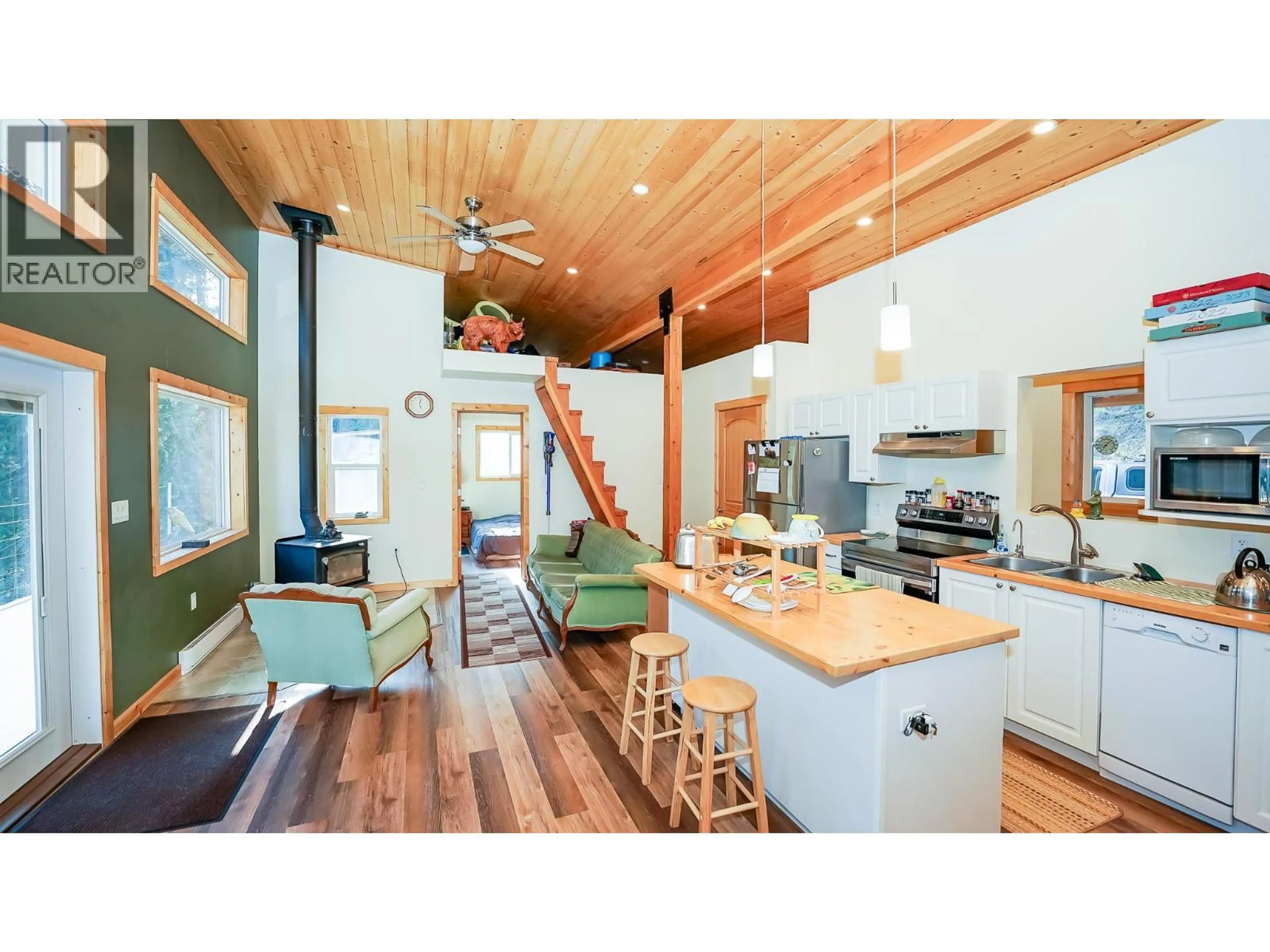 Open concept kitchen, wood/laminate floor for 1771 SKIMIKIN ROAD, Tappen British Columbia V0E2X0