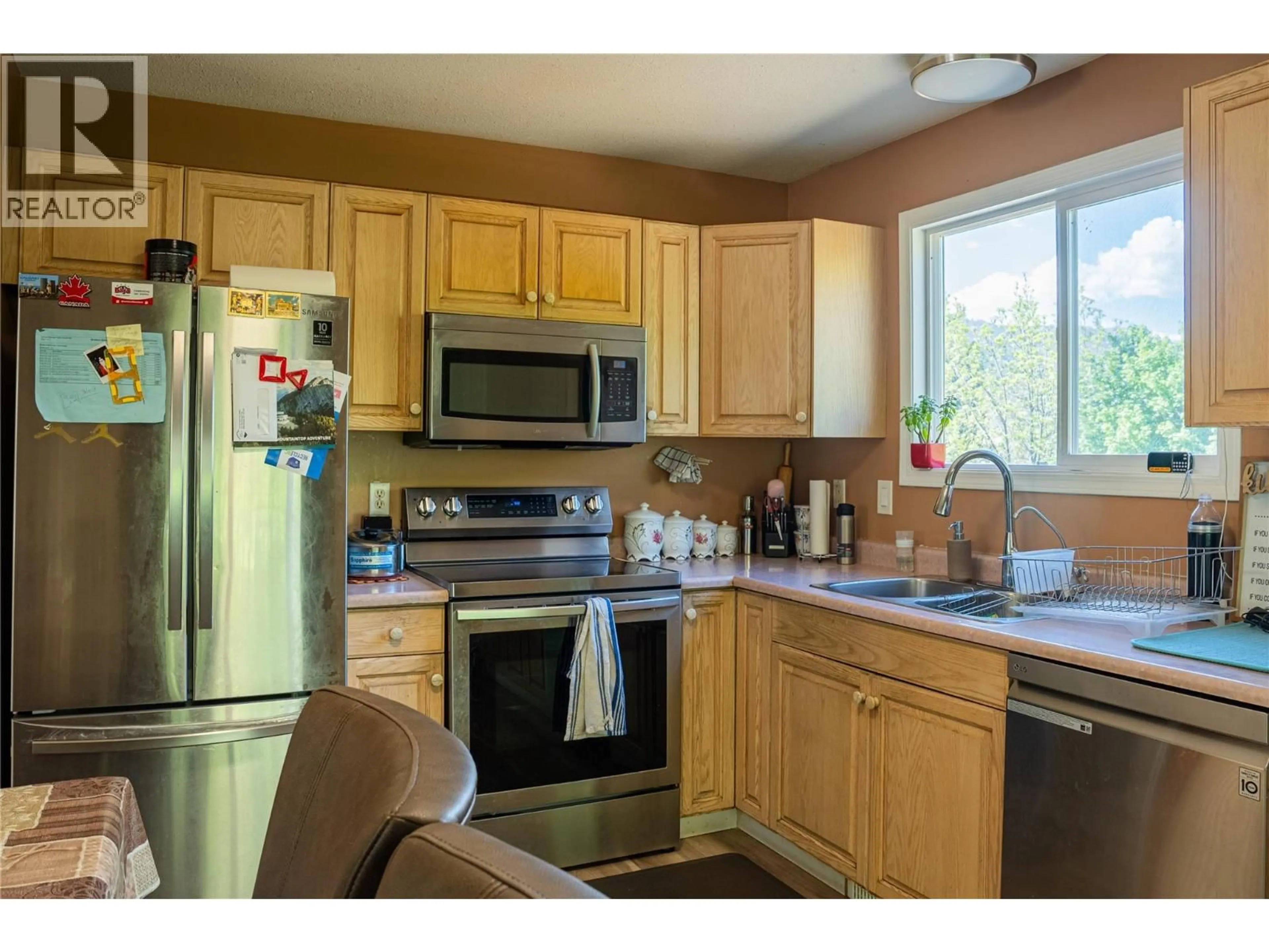 Standard kitchen, wood/laminate floor for 1150-1152 HUDSON ROAD, Kelowna British Columbia V1Z1J3