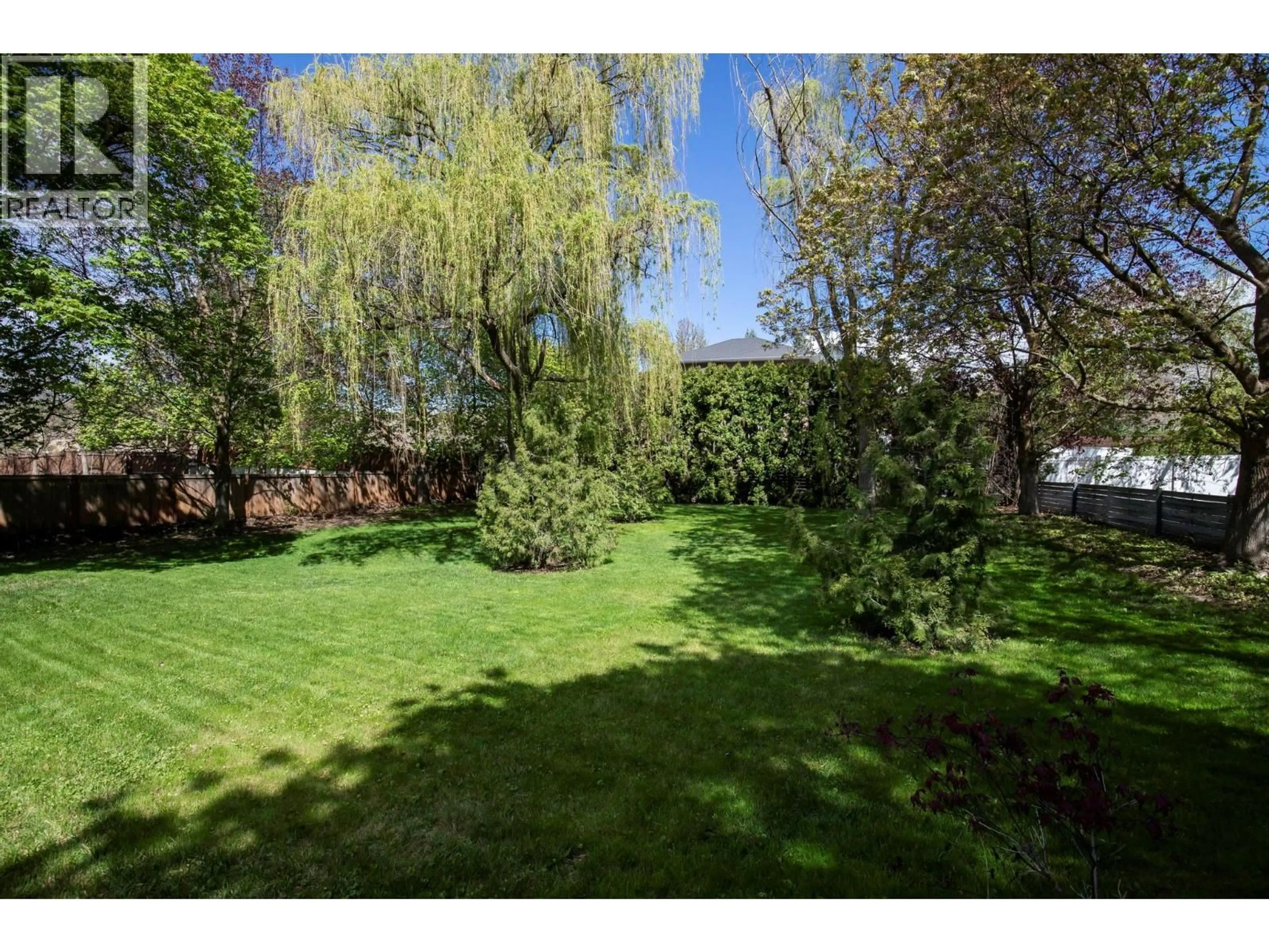 A pic from outside/outdoor area/front of a property/back of a property/a pic from drone, forest/trees view for 4621 PARKRIDGE DRIVE, Kelowna British Columbia V1W3A9