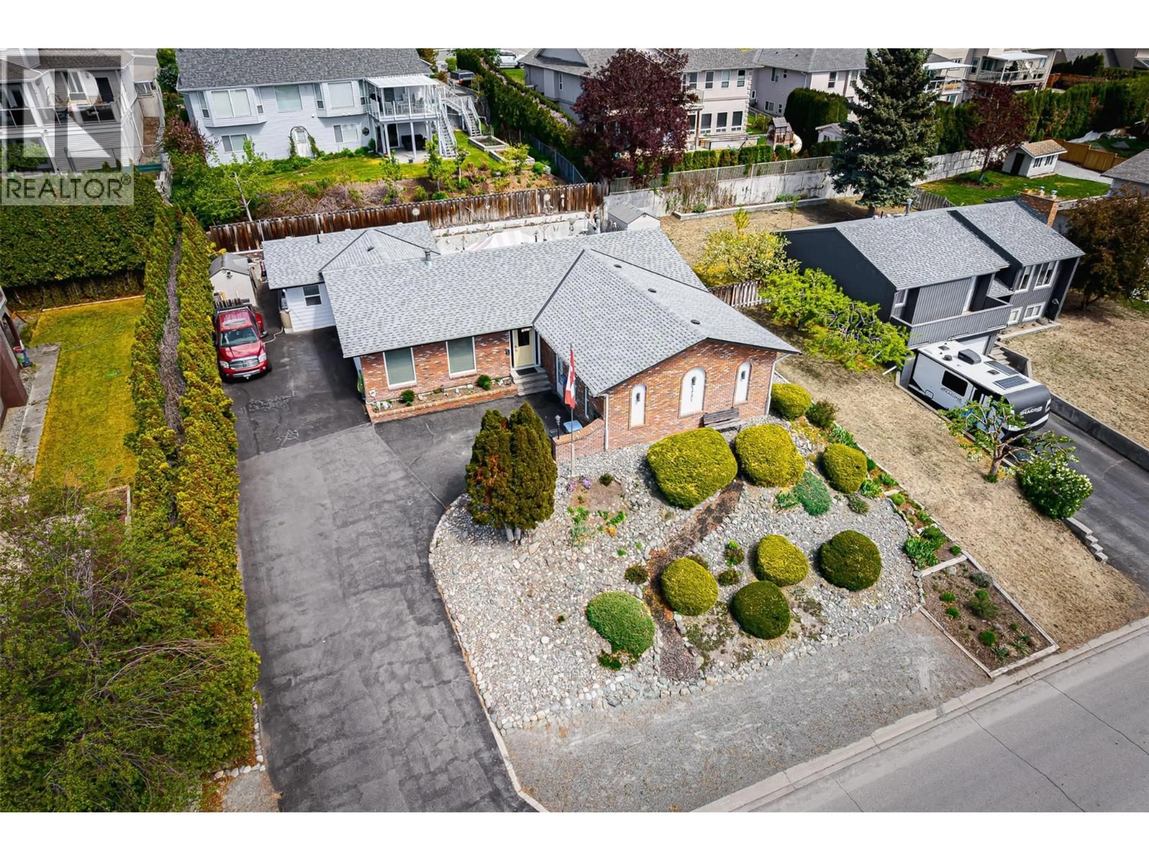 A pic from outside/outdoor area/front of a property/back of a property/a pic from drone, street for 1751 JUNIPER DRIVE, Merritt British Columbia V1K1J6