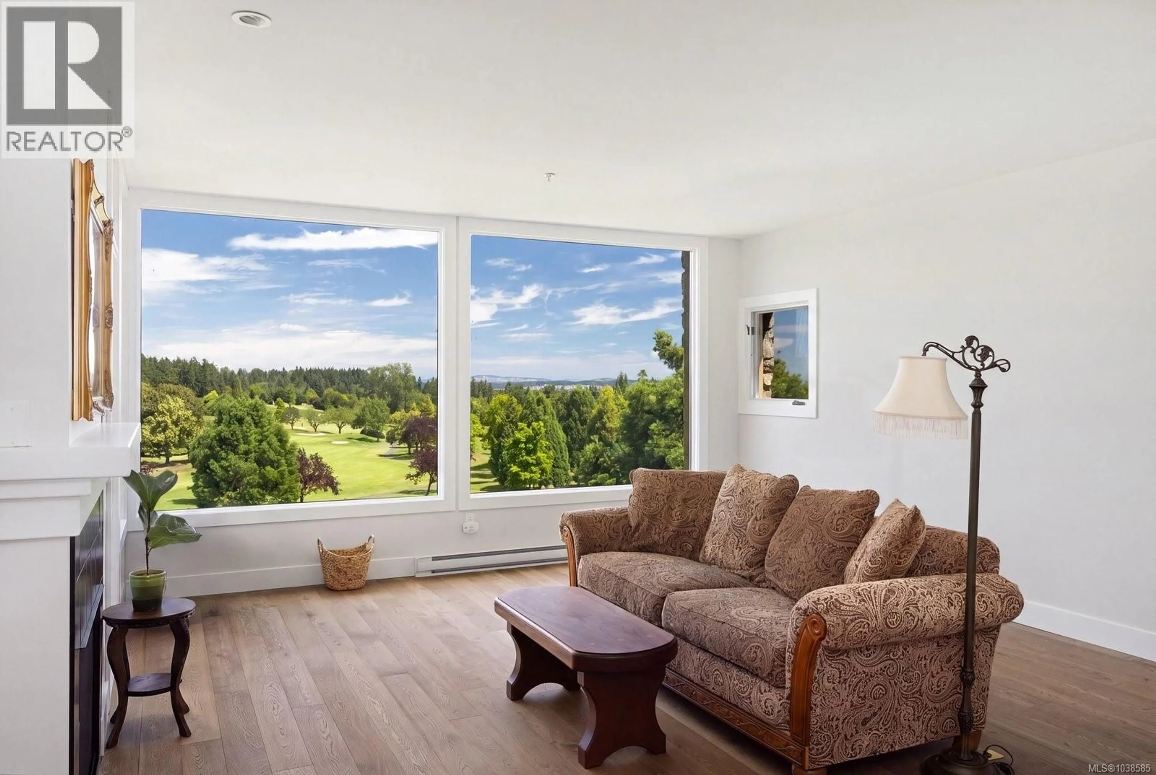 Living room with furniture, wood/laminate floor for 304 - 5327 CORDOVA BAY ROAD, Saanich British Columbia V8Y2L3
