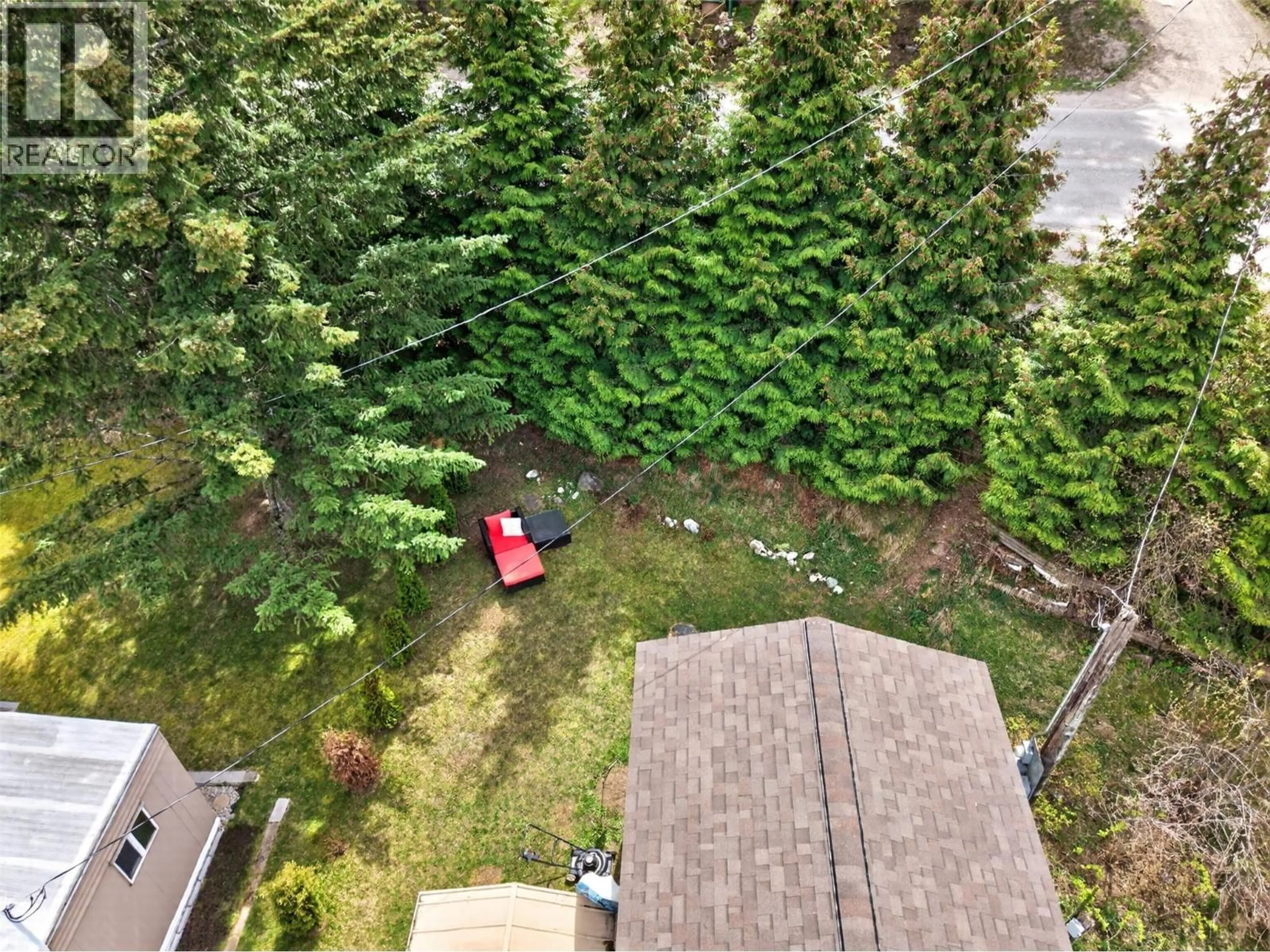 A pic from outside/outdoor area/front of a property/back of a property/a pic from drone, forest/trees view for 32 - 1554 GRANITE ROAD, Nelson British Columbia V1L6T6