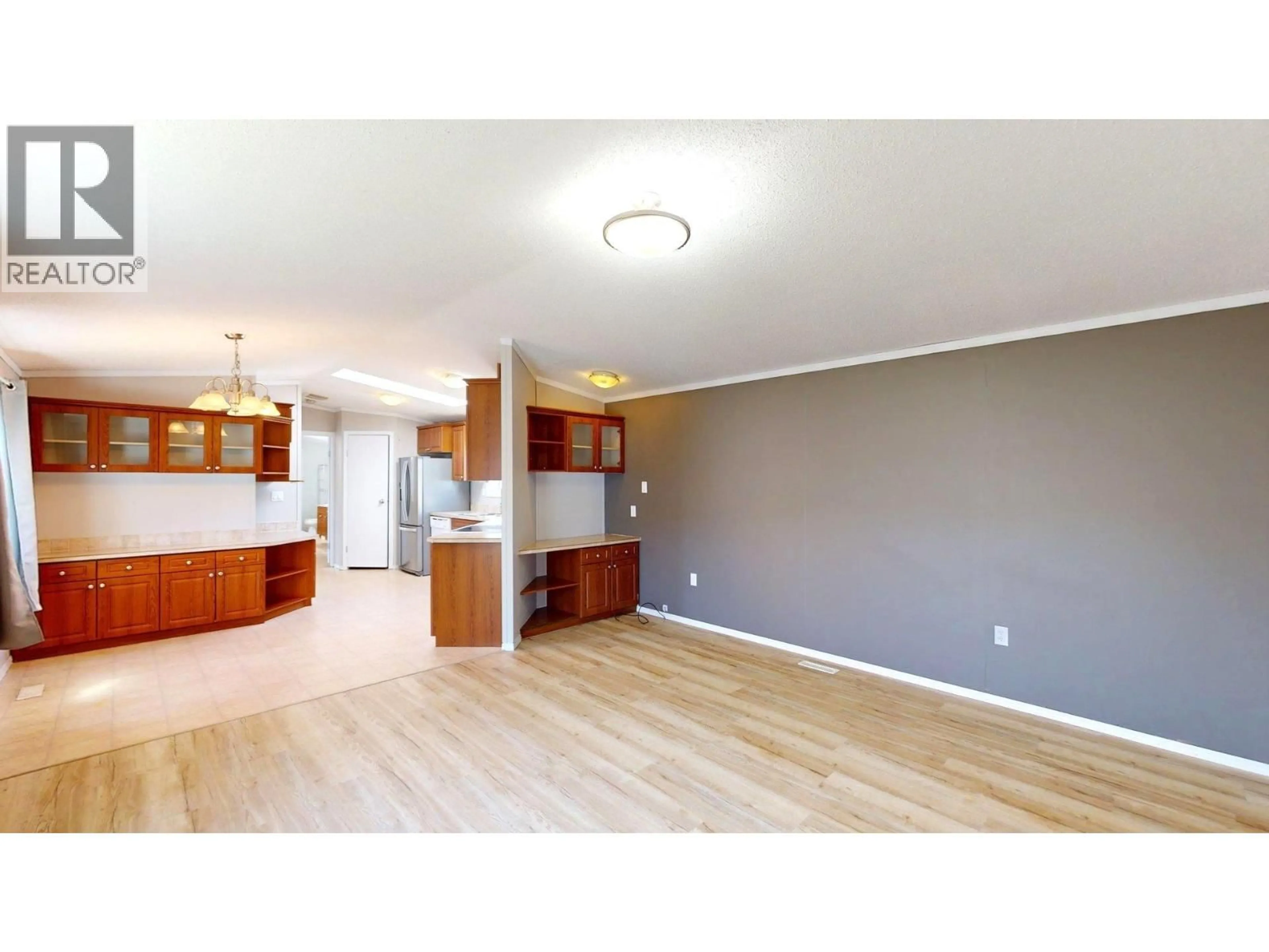 Open concept kitchen, wood/laminate floor for 121 - 100 ASPEN DRIVE, Sparwood British Columbia V0B2G0