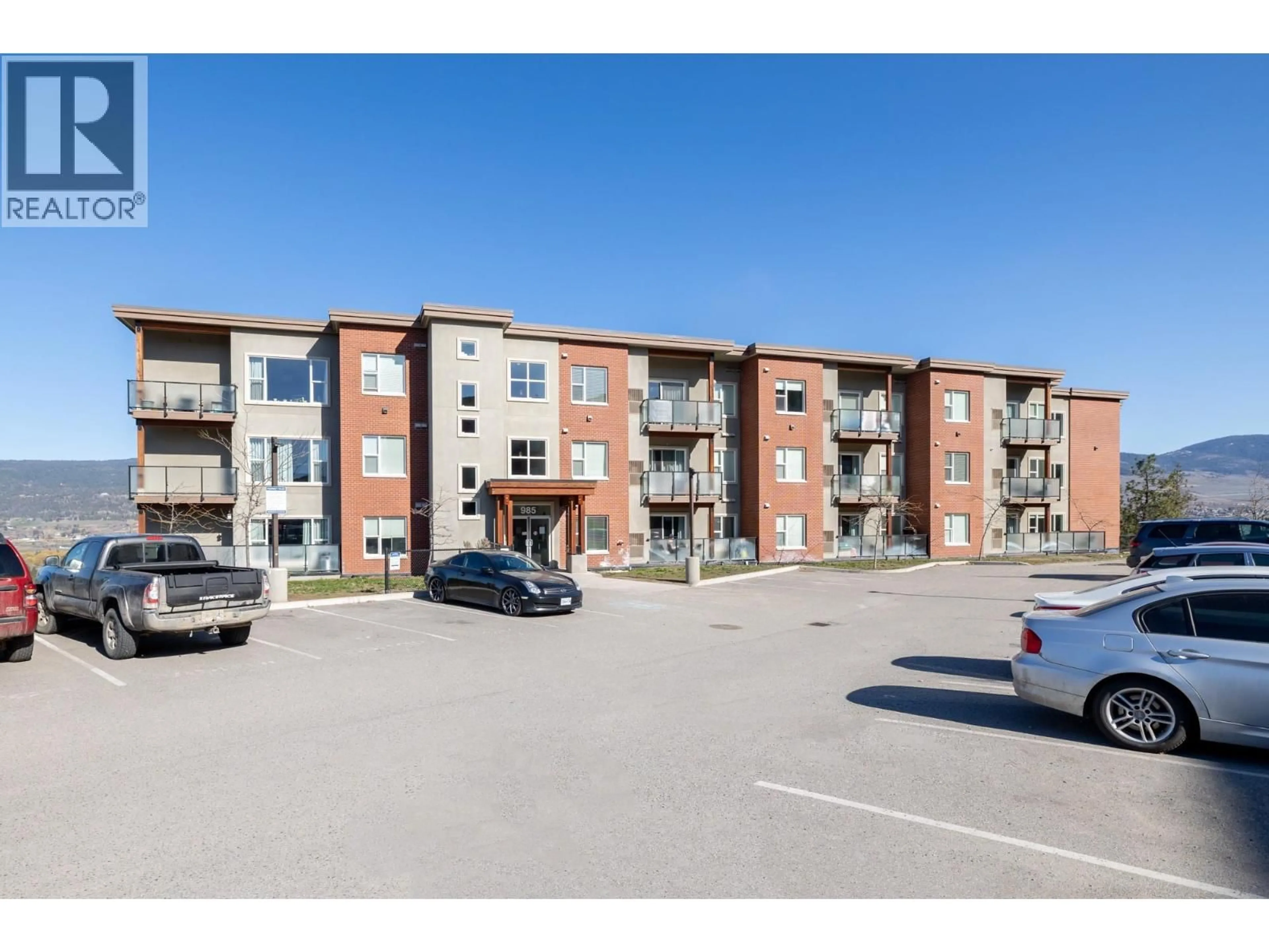 A pic from outside/outdoor area/front of a property/back of a property/a pic from drone, unknown for 310 - 985 ACADEMY WAY, Kelowna British Columbia V1V3C8