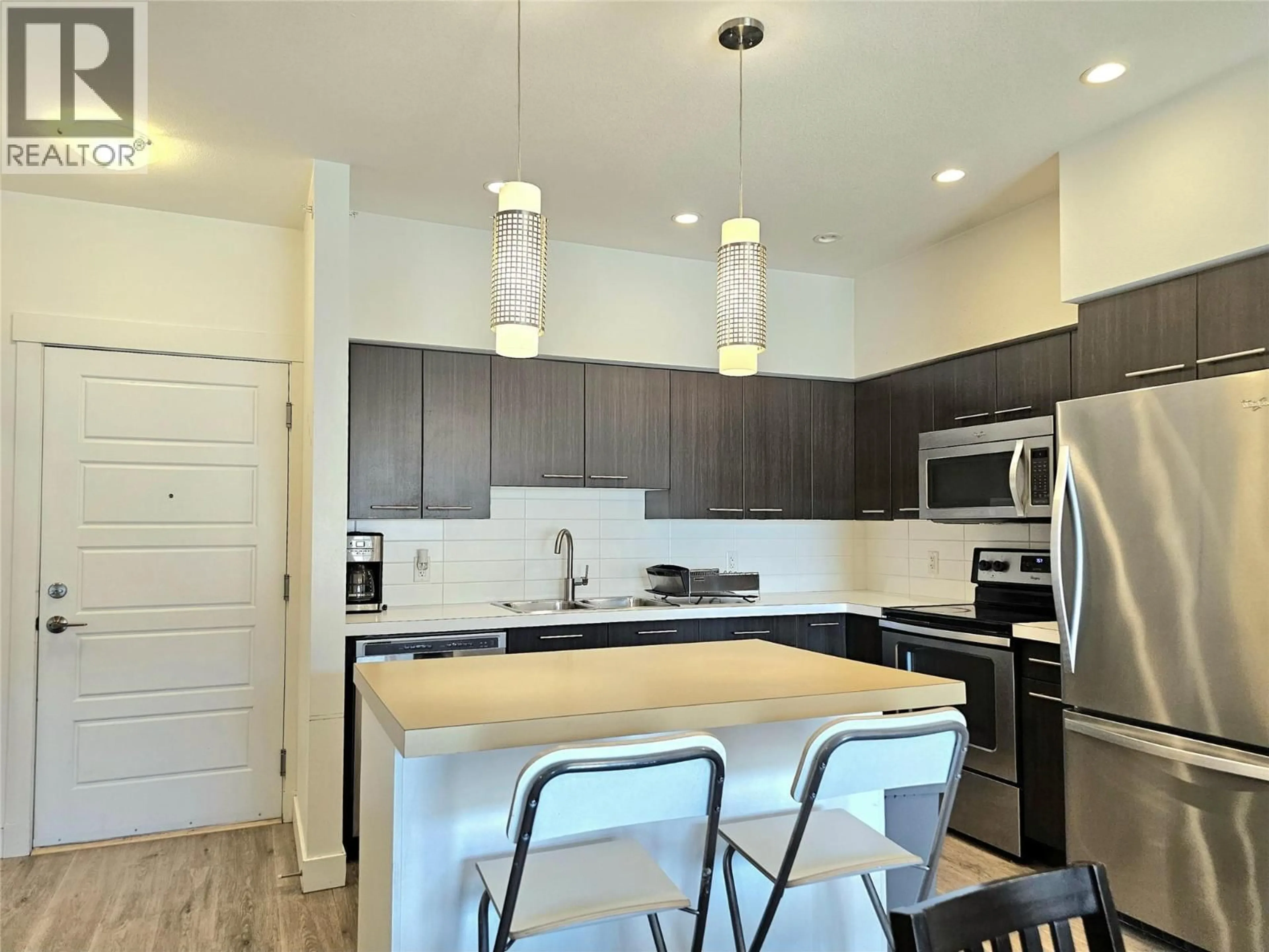 Open concept kitchen, unknown for 310 - 985 ACADEMY WAY, Kelowna British Columbia V1V3C8