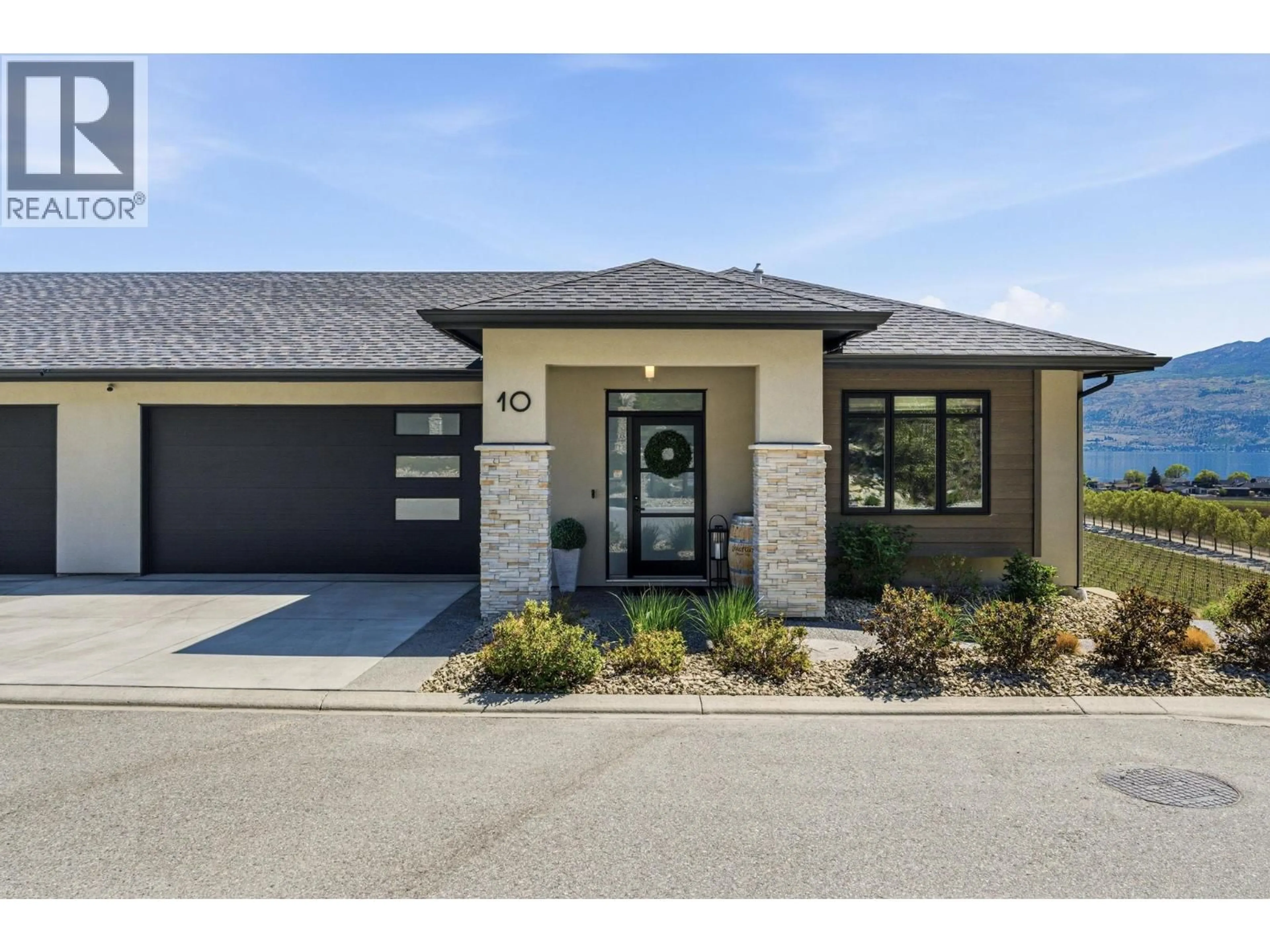 Home with brick exterior material, street for 10 - 1600 GOLDENVIEW DRIVE, West Kelowna British Columbia V4T1Y7