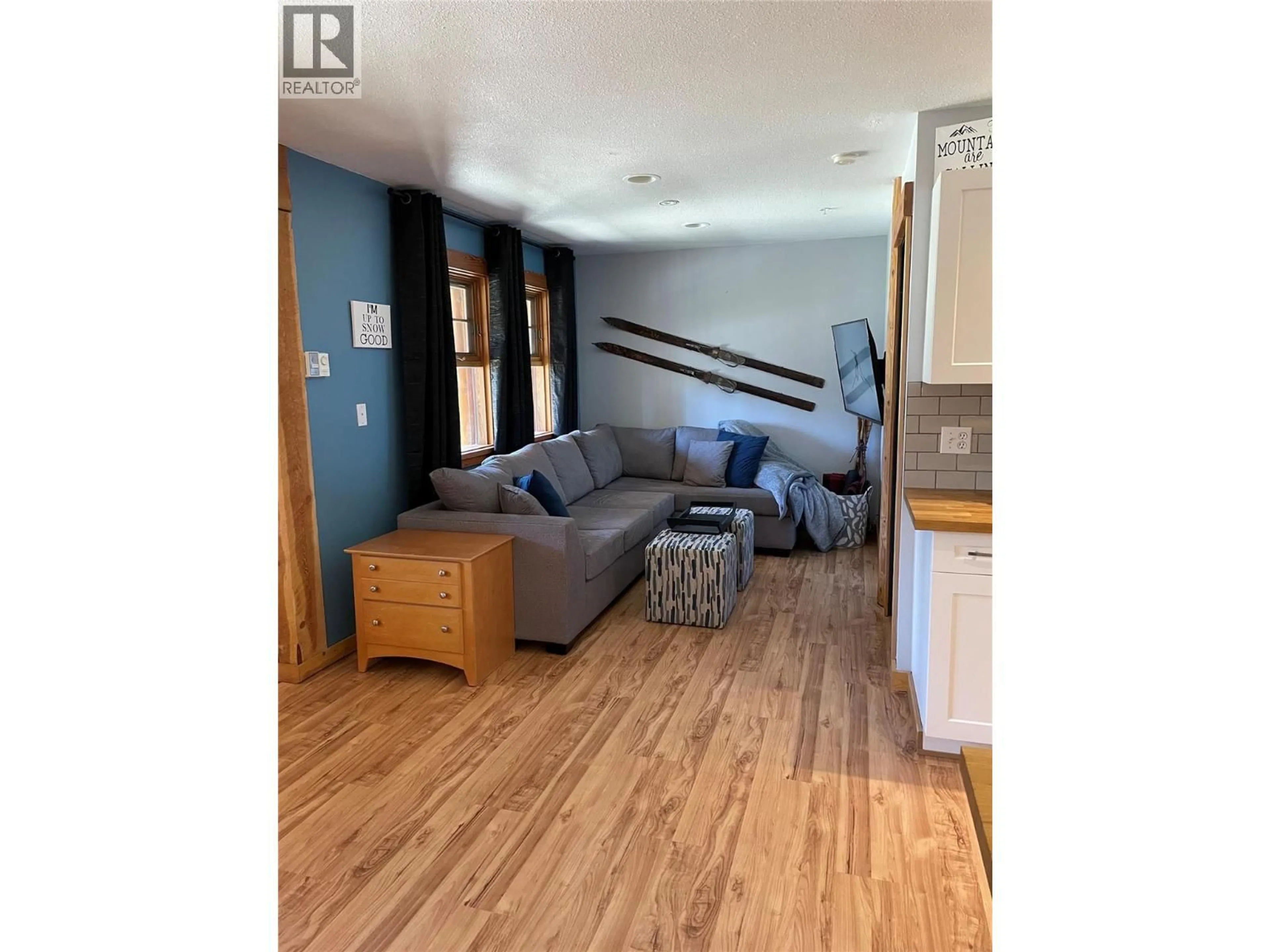 Living room with furniture, wood/laminate floor for D - 4809 SNOW PINES ROAD, Big White British Columbia V1P1P3