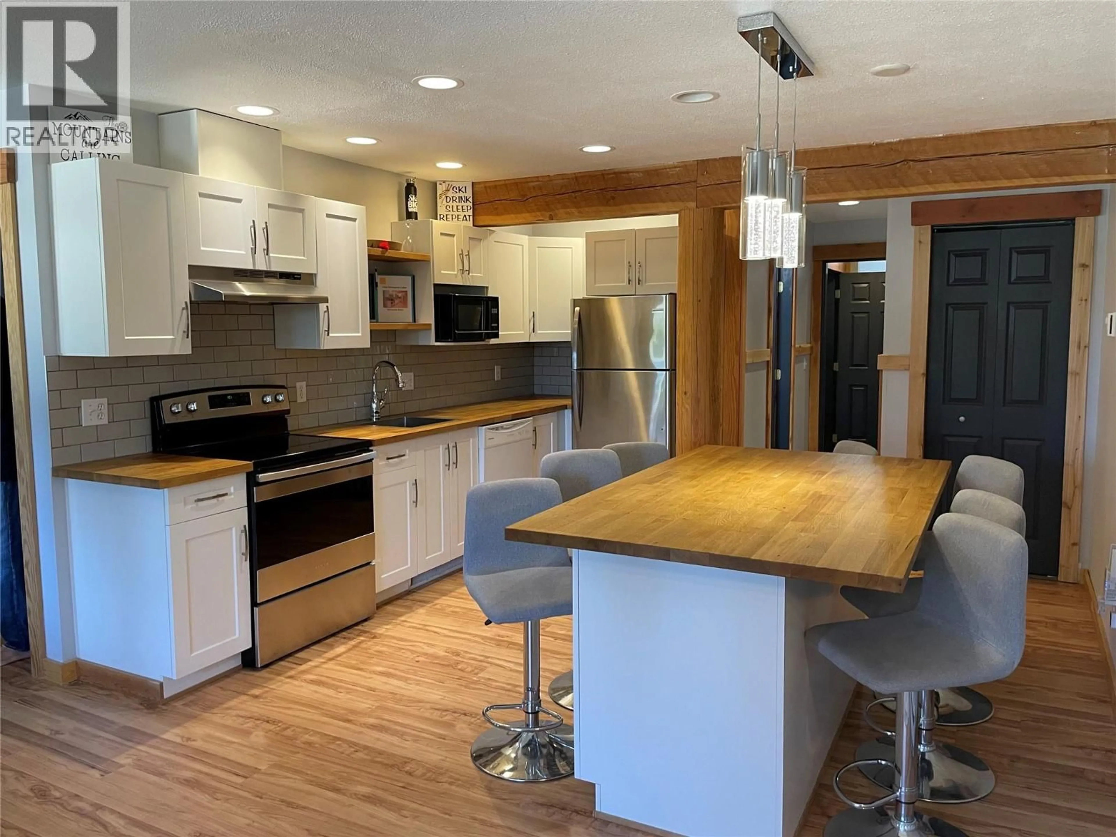 Open concept kitchen, wood/laminate floor for D - 4809 SNOW PINES ROAD, Big White British Columbia V1P1P3