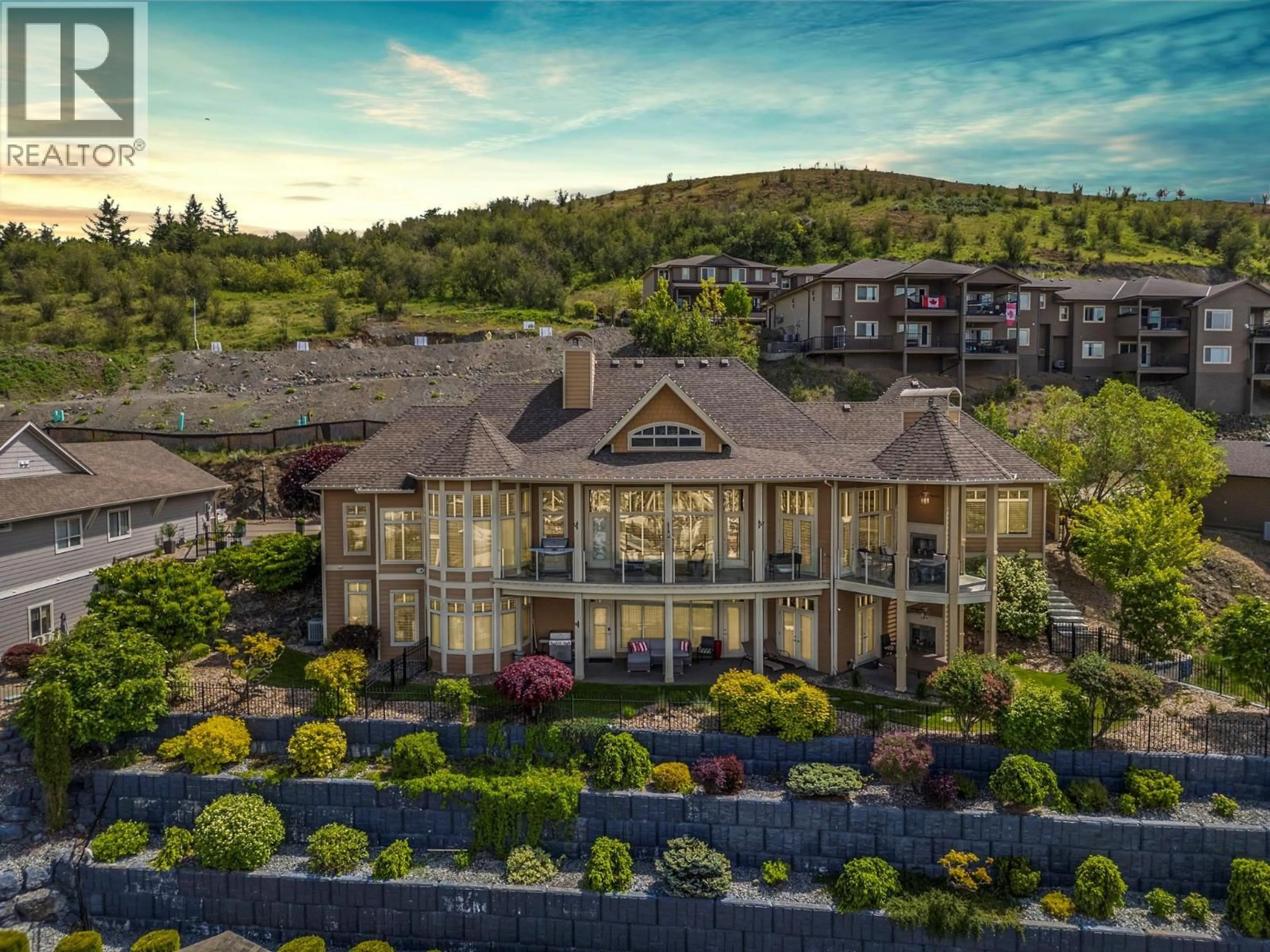 A pic from outside/outdoor area/front of a property/back of a property/a pic from drone, mountain view for 10 - 1117 MT FOSTHALL DRIVE, Vernon British Columbia V1B3Z9