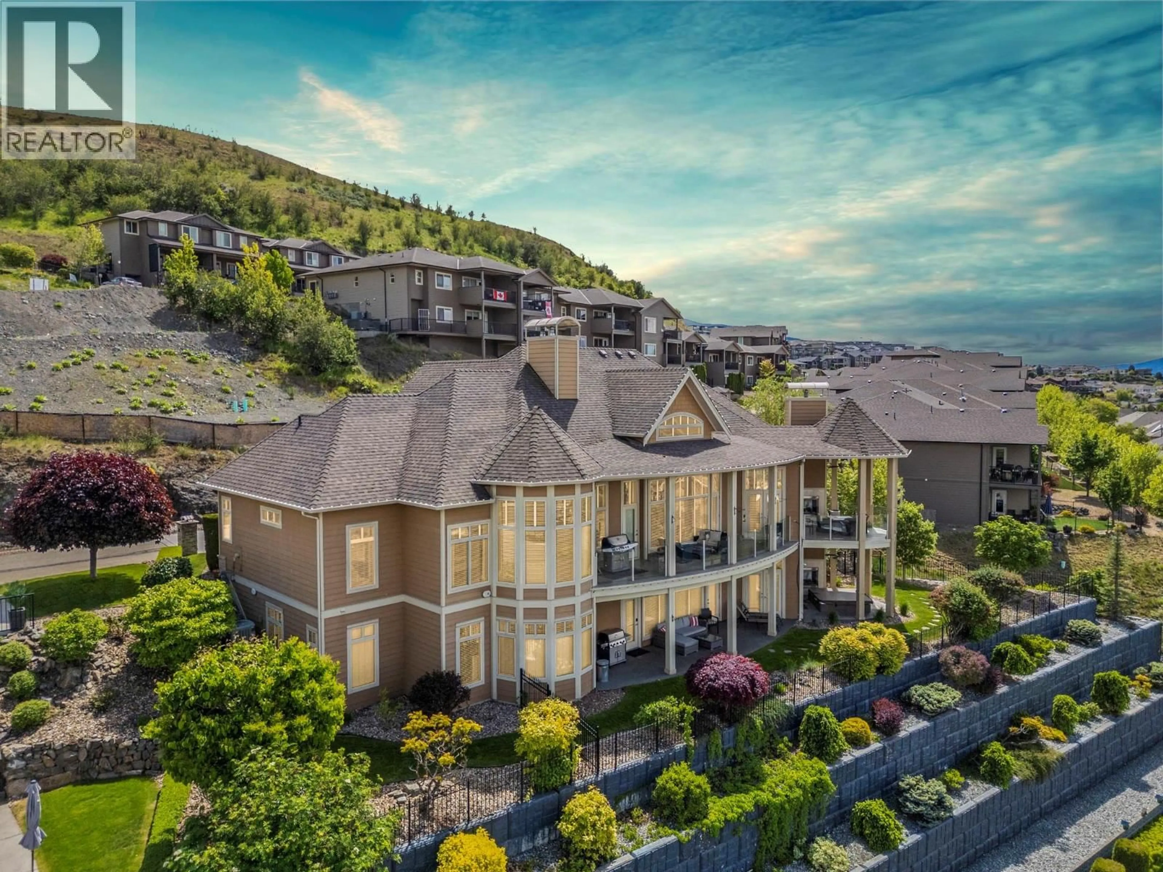 A pic from outside/outdoor area/front of a property/back of a property/a pic from drone, mountain view for 10 - 1117 MT FOSTHALL DRIVE, Vernon British Columbia V1B3Z9