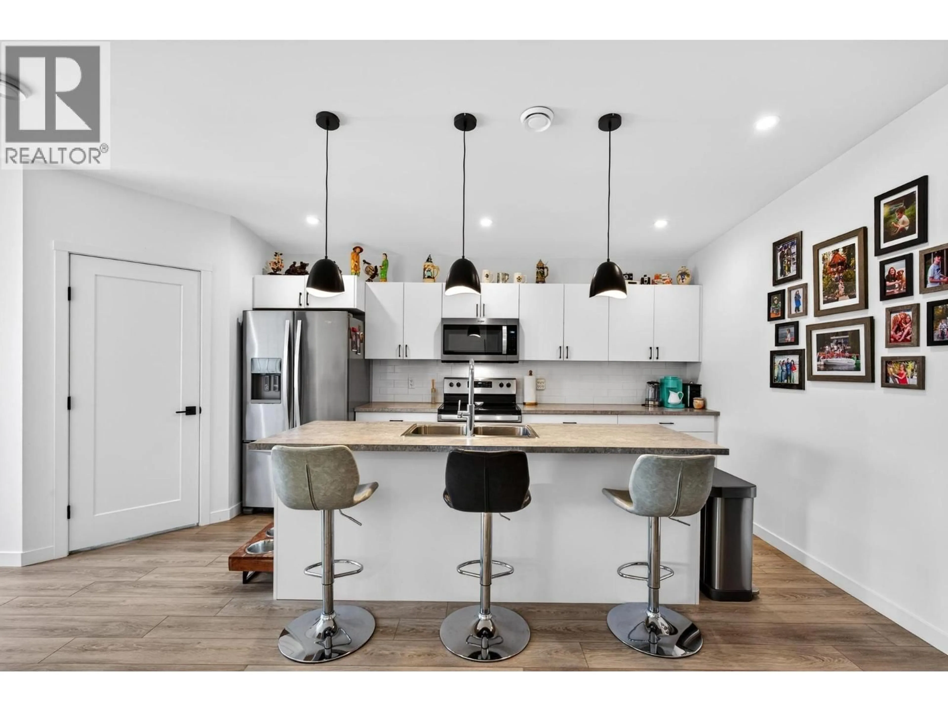 Open concept kitchen, wood/laminate floor for 124 - 8900 JIM BAILEY ROAD, Kelowna British Columbia V4V0B5