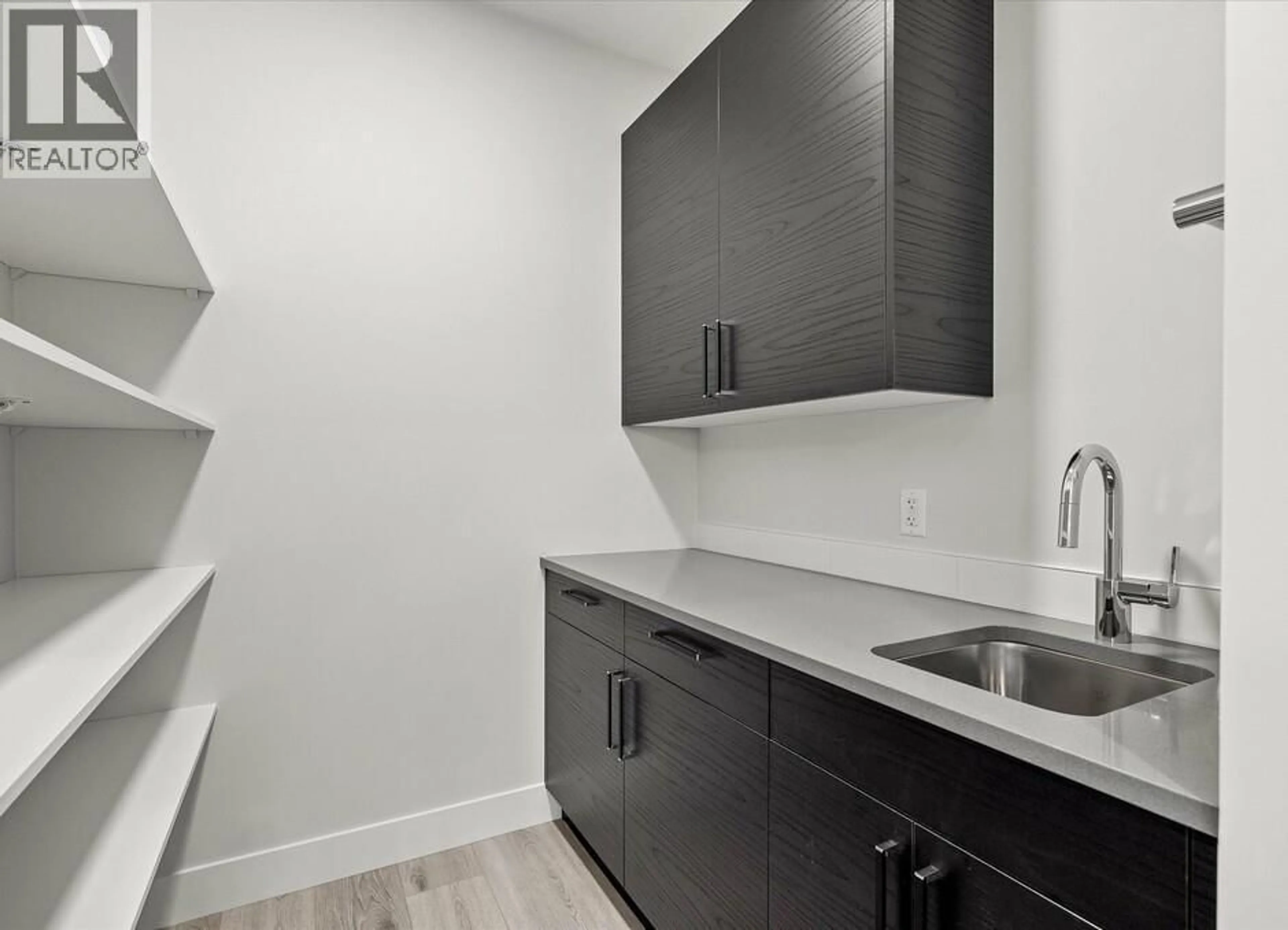 Laundry room for 1221 LONE PINE DRIVE, Kelowna British Columbia V1P0A5