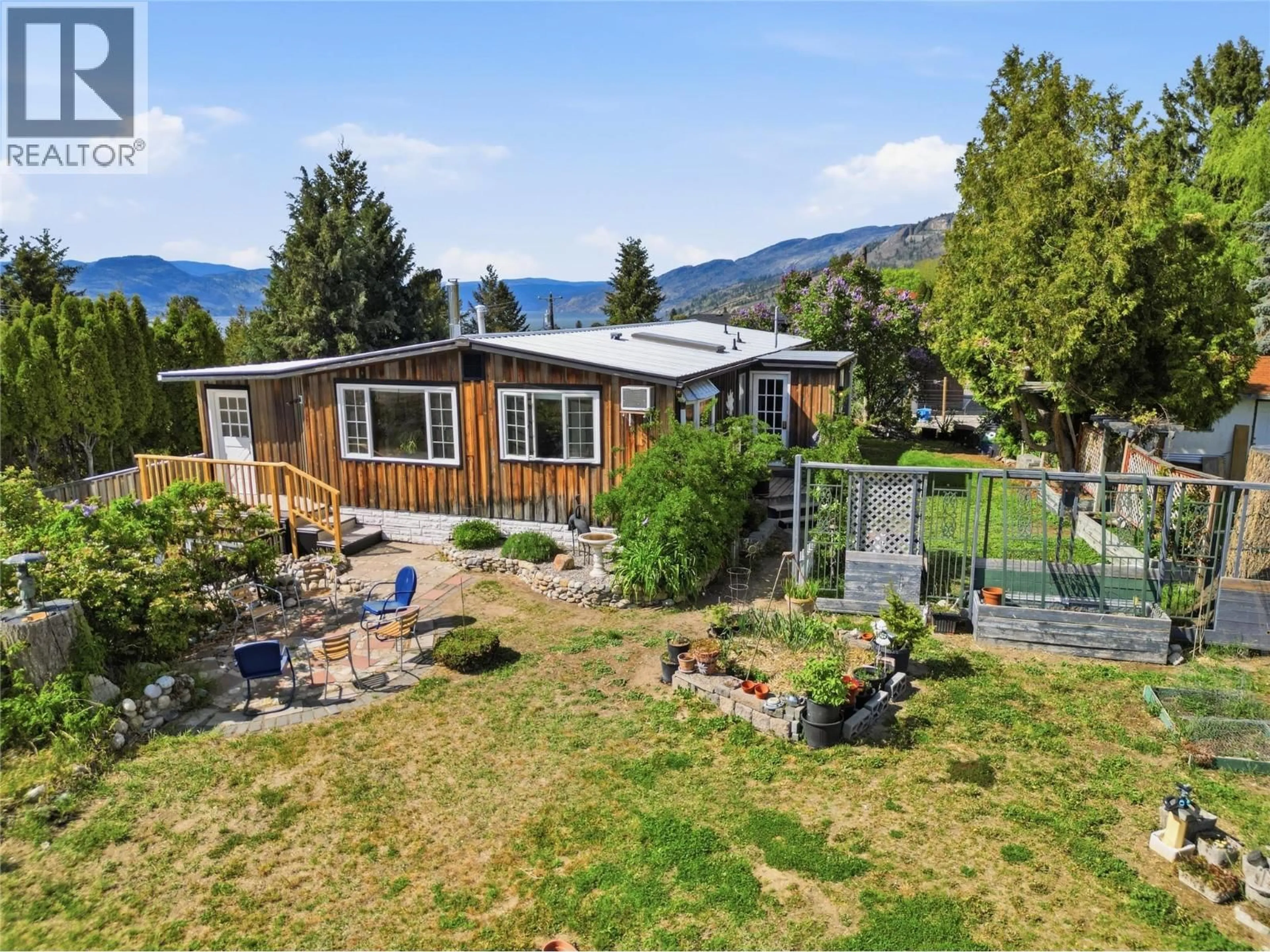 A pic from outside/outdoor area/front of a property/back of a property/a pic from drone, mountain view for 905 LOWER DEBECK ROAD, Naramata British Columbia V0H1N1