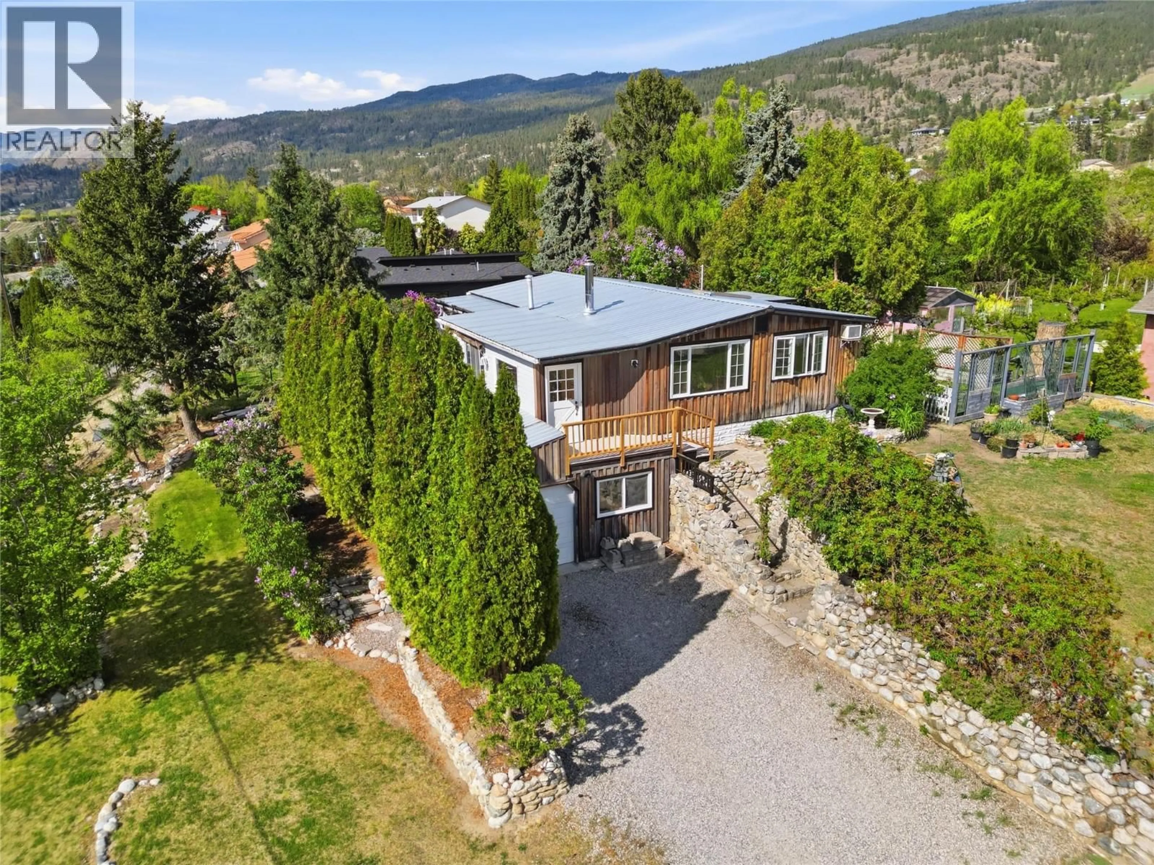 A pic from outside/outdoor area/front of a property/back of a property/a pic from drone, mountain view for 905 LOWER DEBECK ROAD, Naramata British Columbia V0H1N1