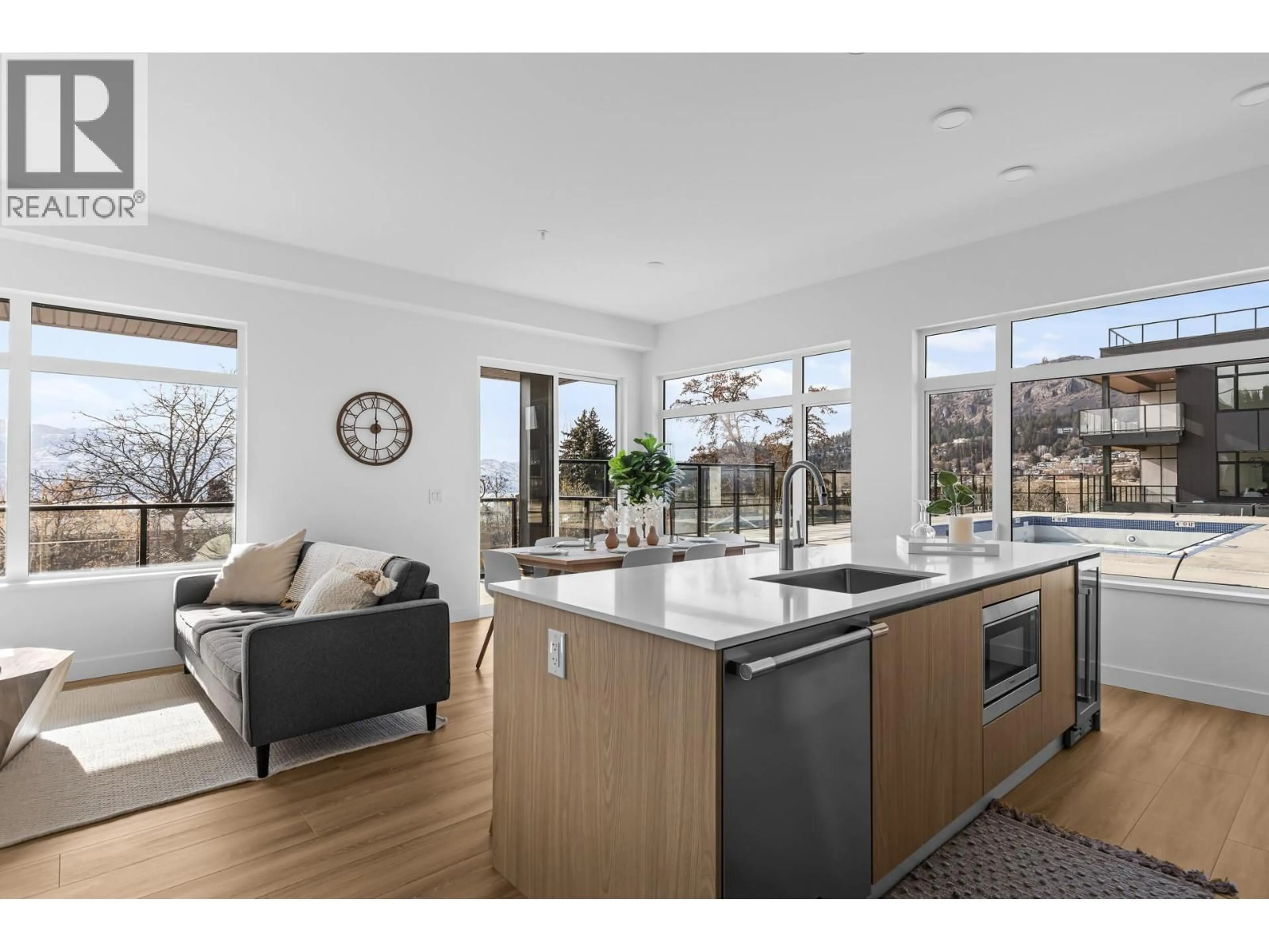 Open concept kitchen, wood/laminate floor for 105 - 2780 OLALLA ROAD, West Kelowna British Columbia V1Z2A9