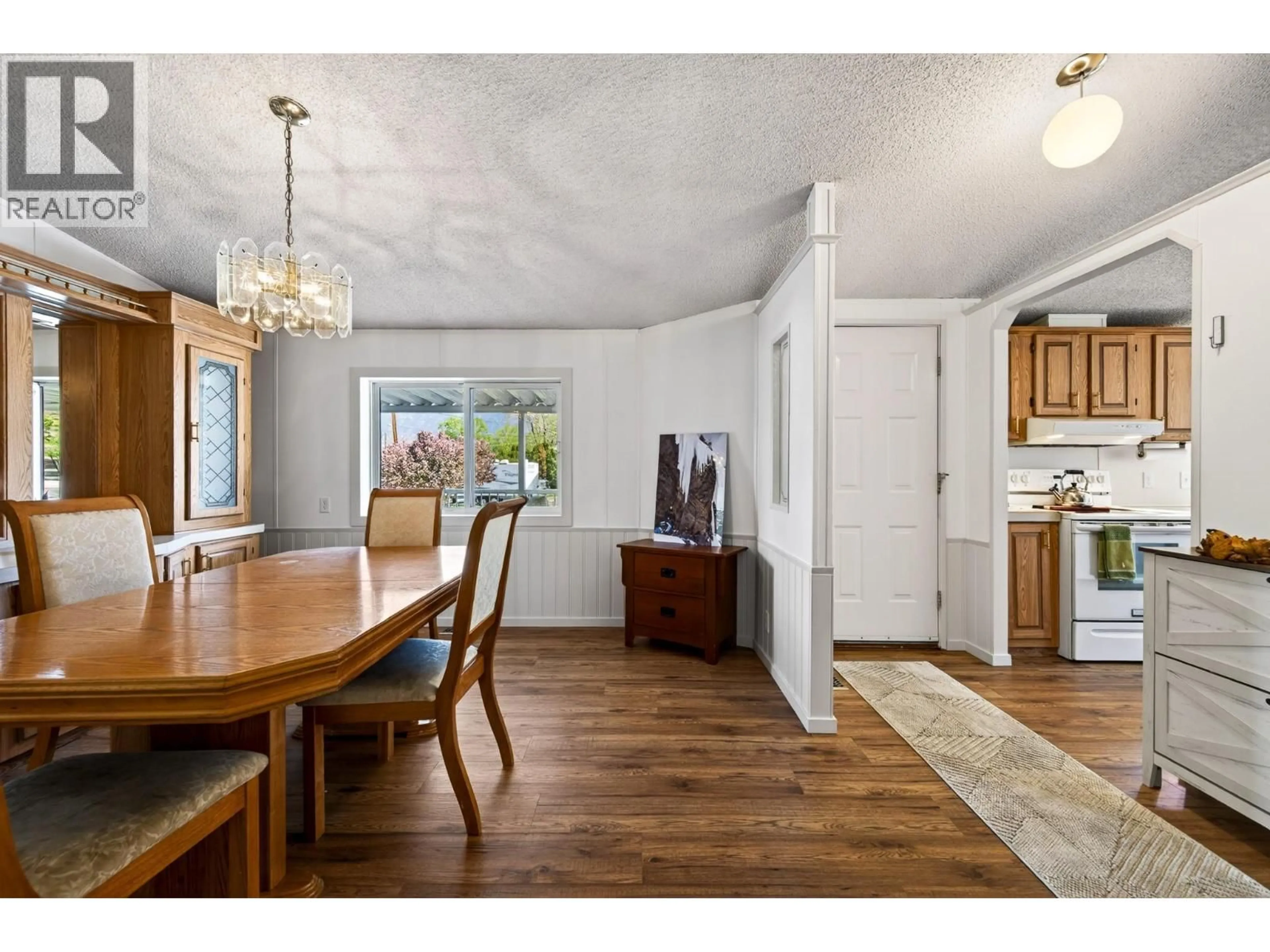 Dining room, wood/laminate floor for 7070 WATSON DRIVE EAST, Kamloops British Columbia V0K2J0