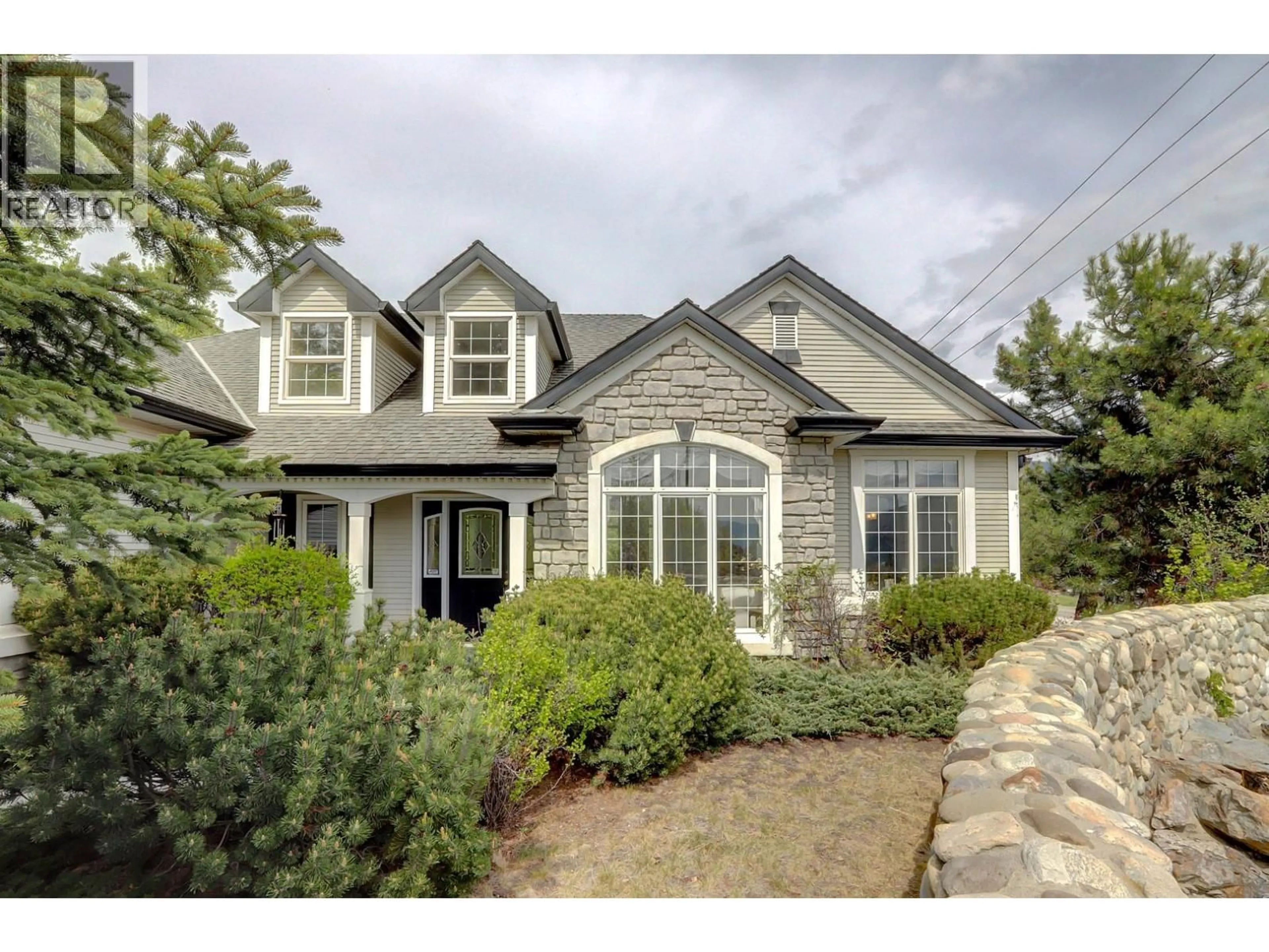 Home with brick exterior material, street for 1101 PHOENIX DRIVE, Vernon British Columbia V1B3M4