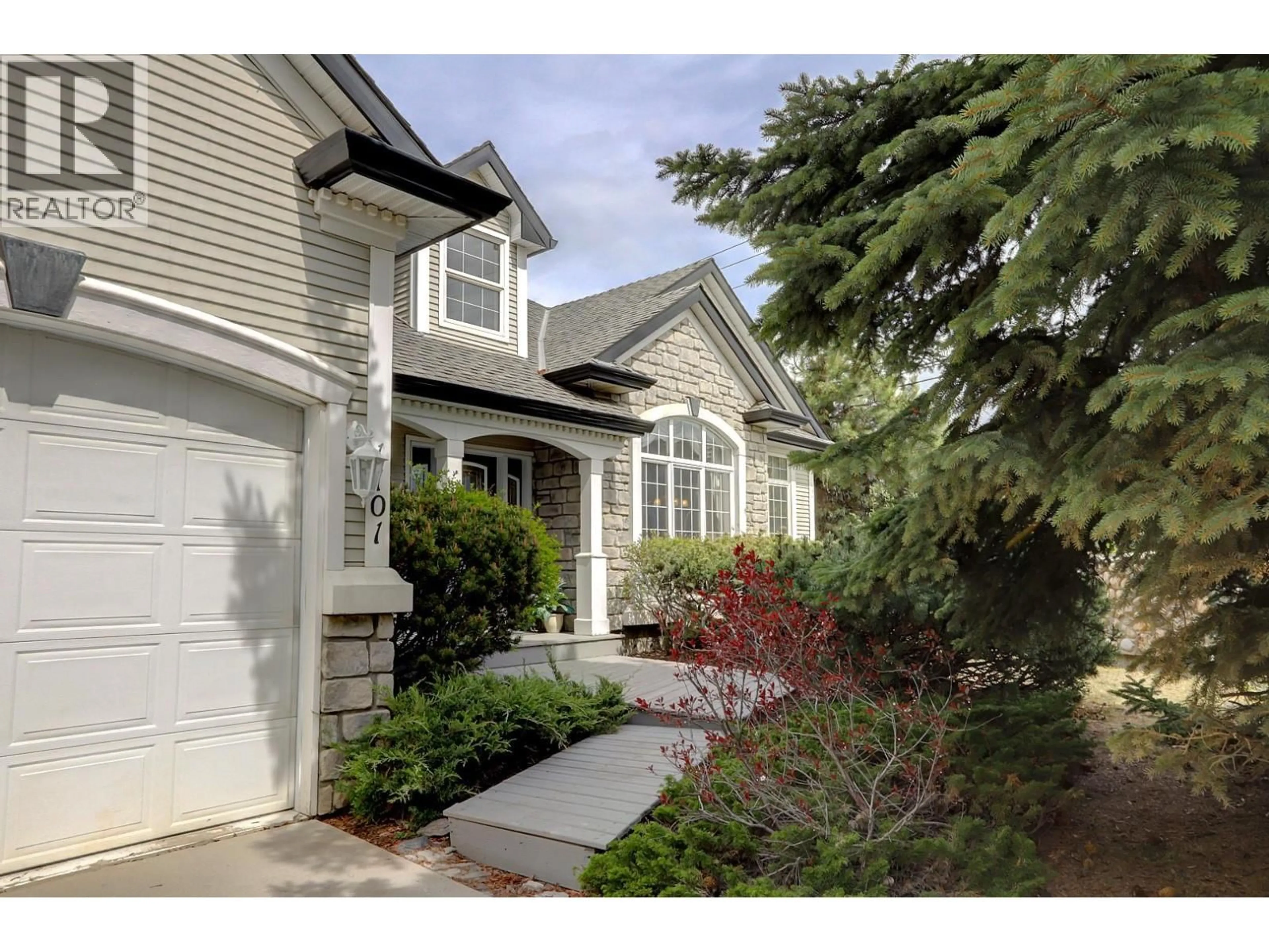 Home with vinyl exterior material, street for 1101 PHOENIX DRIVE, Vernon British Columbia V1B3M4