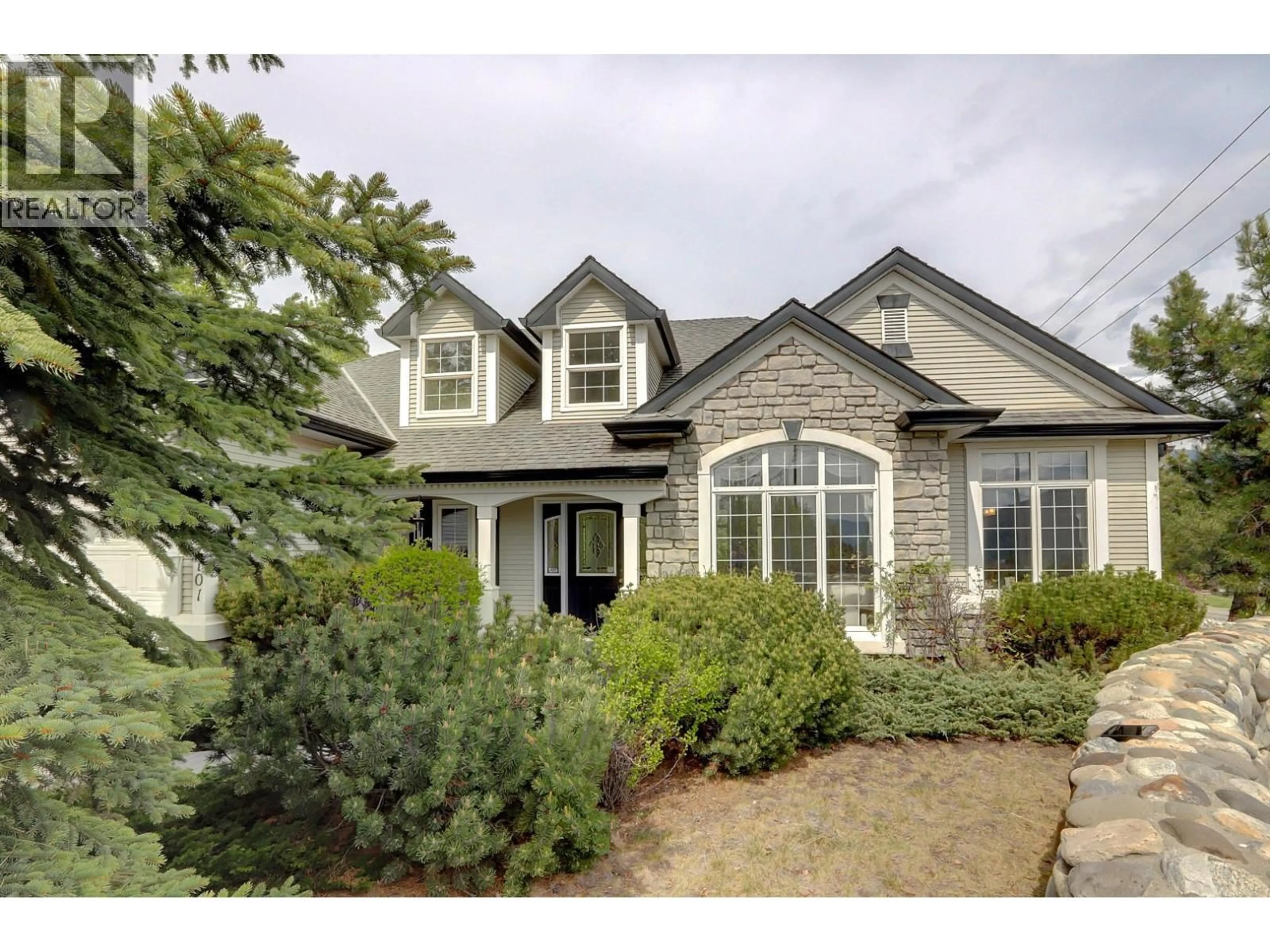 Home with brick exterior material, street for 1101 PHOENIX DRIVE, Vernon British Columbia V1B3M4