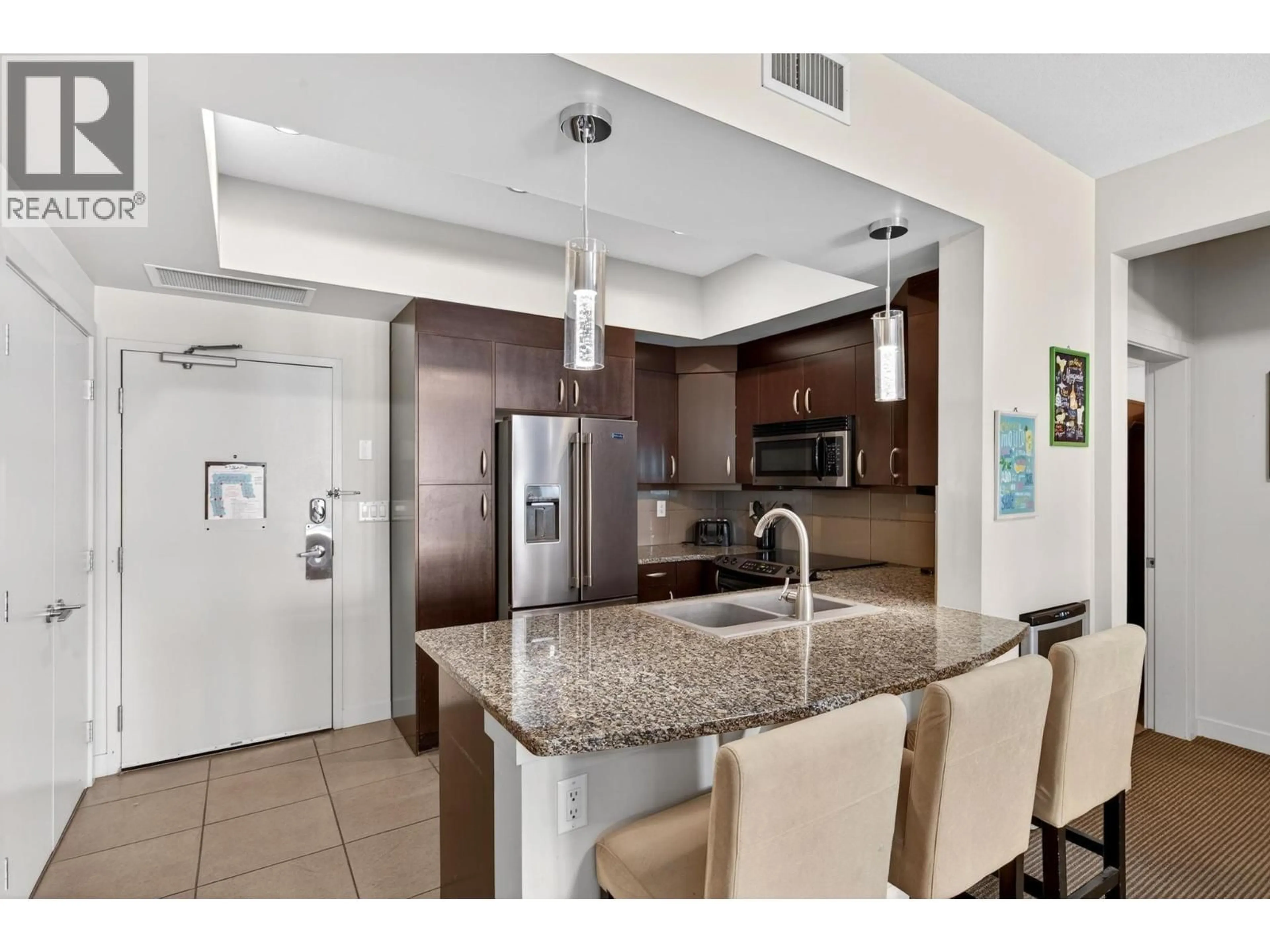Open concept kitchen, ceramic/tile floor for 1117 - 7343 OKANAGAN LANDING ROAD, Vernon British Columbia V1H2J6
